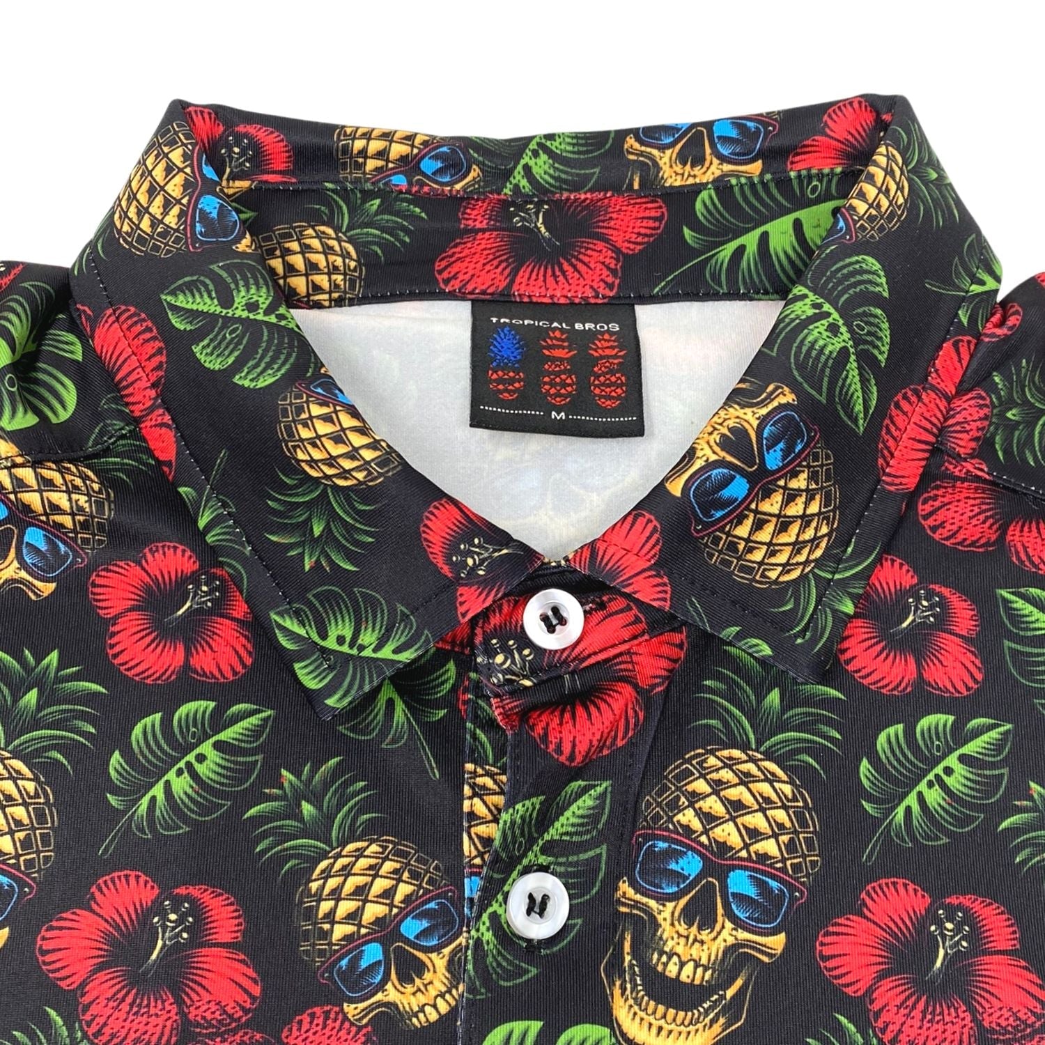 Colorful tropical patterned shirt with skull design on a white background