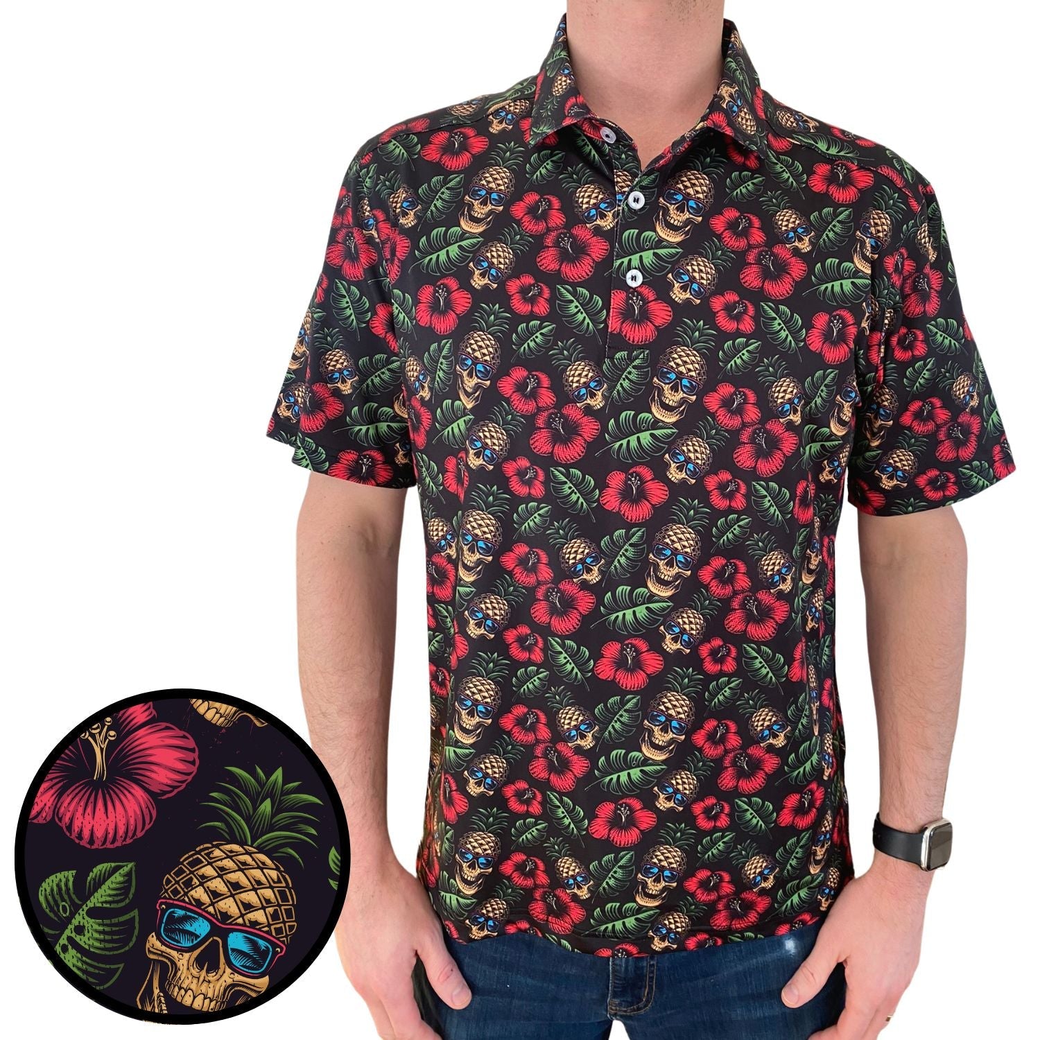 Man wearing a colorful floral and pineapple patterned shirt on a white background