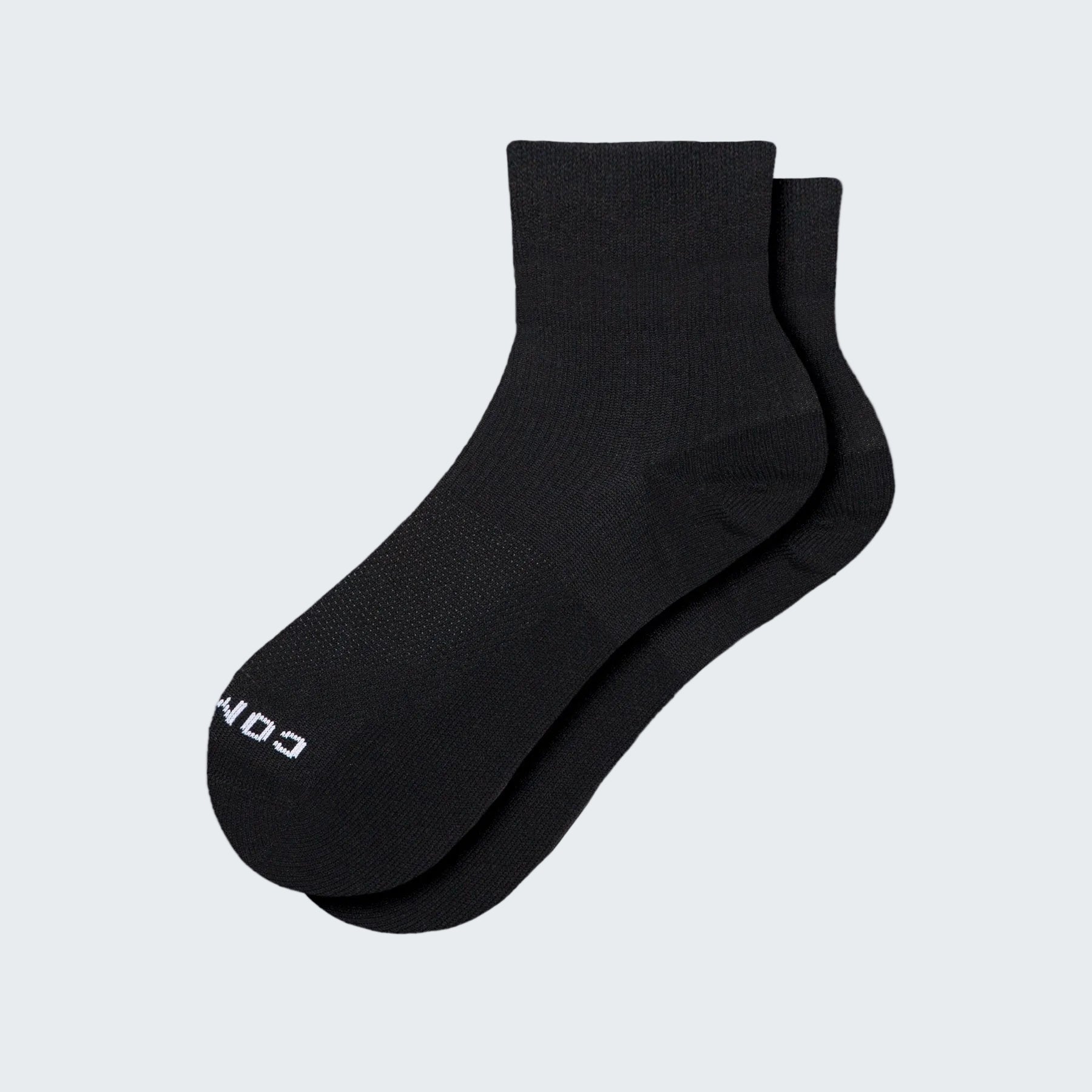 Pair of black socks on a white background