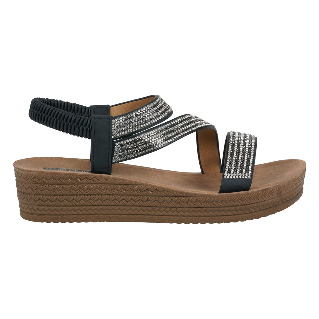 Black sandal with brown sole on a white background