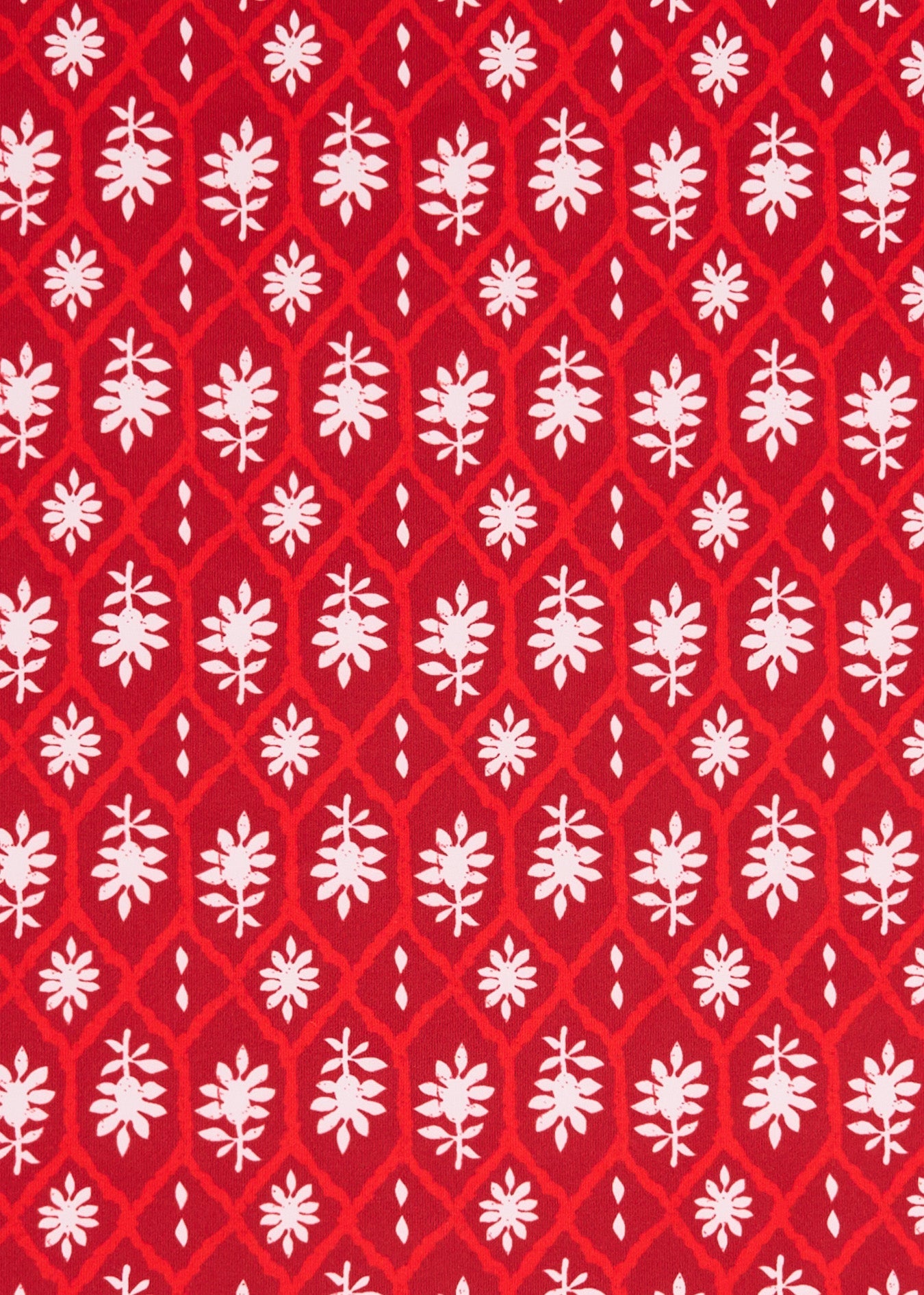 White floral pattern on a red background