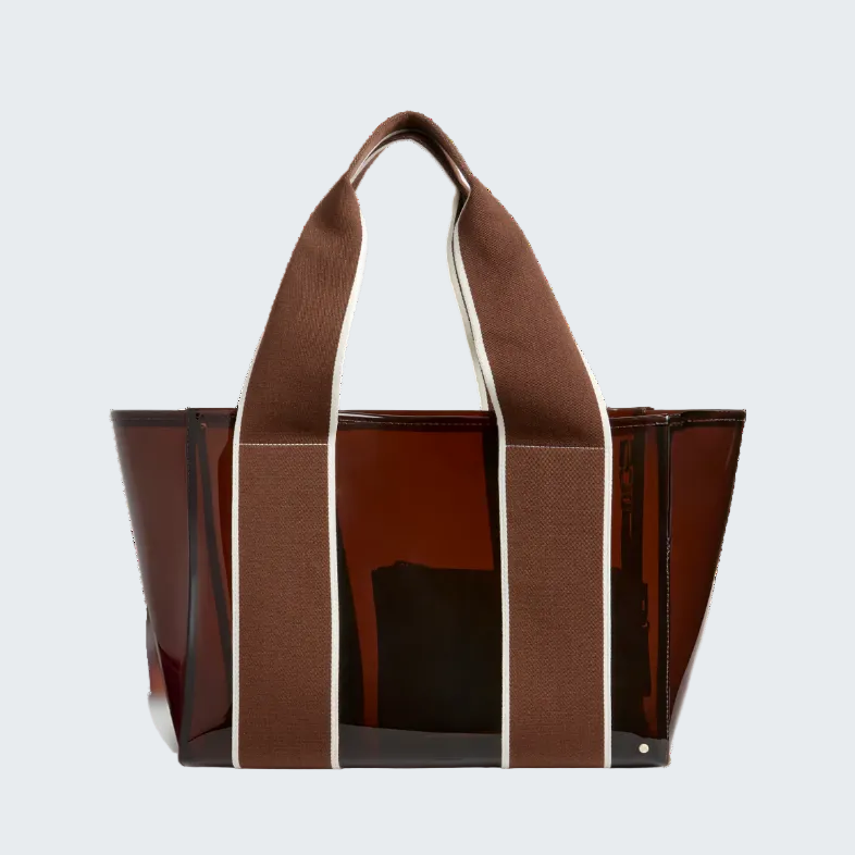 Brown tote bag with a glossy finish on a white background