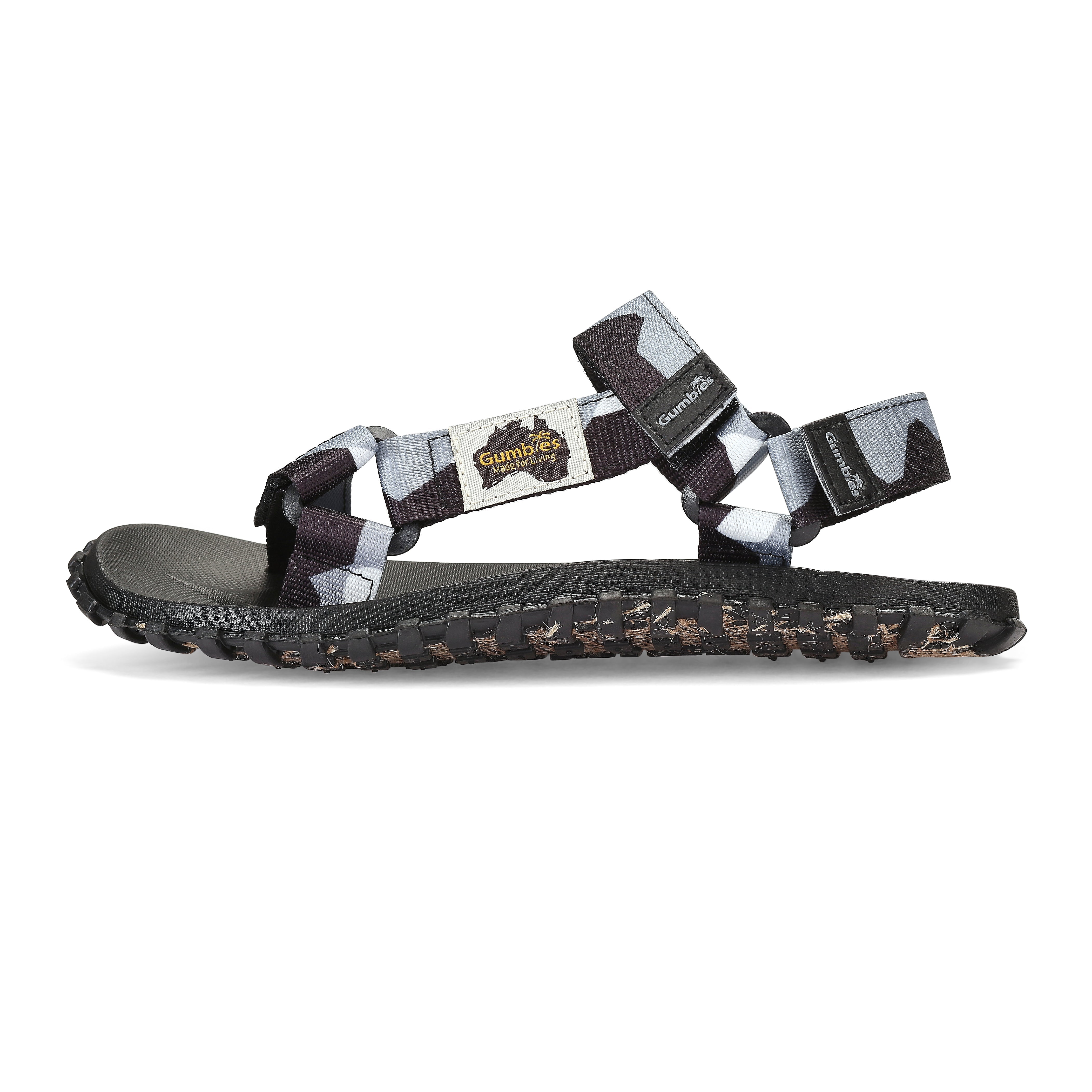 Black sandal with multiple straps on a white background