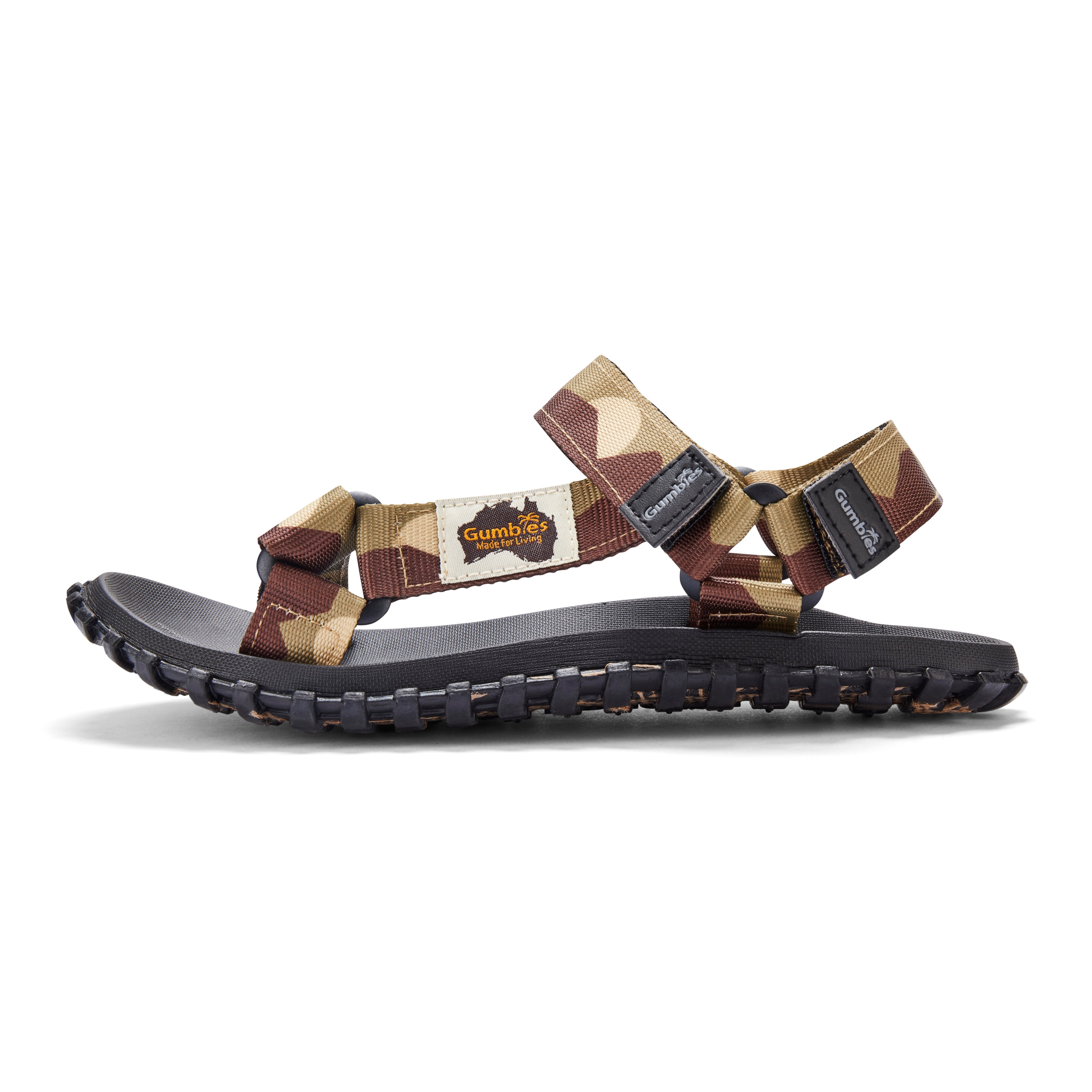 Camouflage-patterned sandal with black sole on a white background