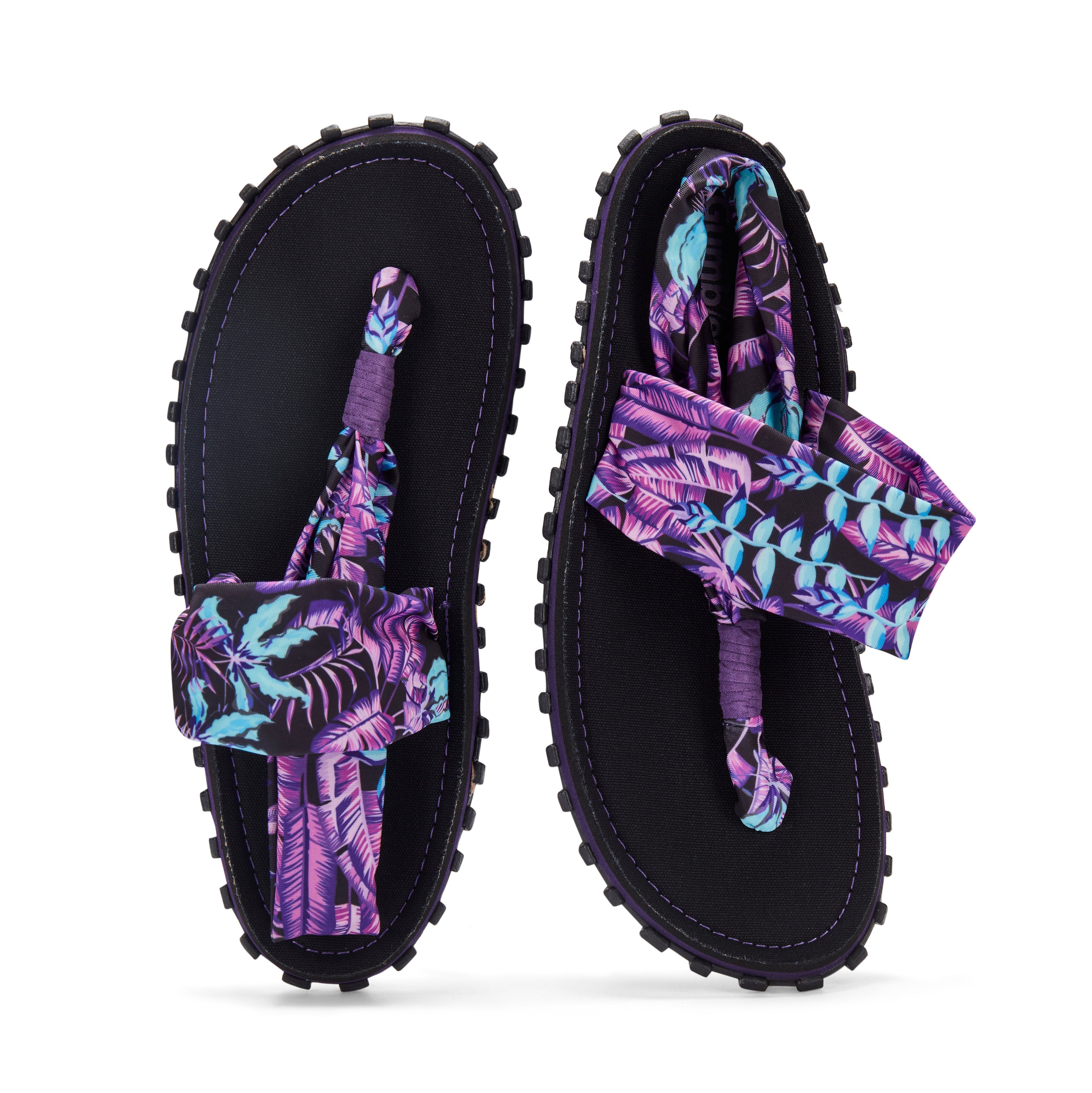 Black sandals with purple and blue leaf pattern straps on a white background