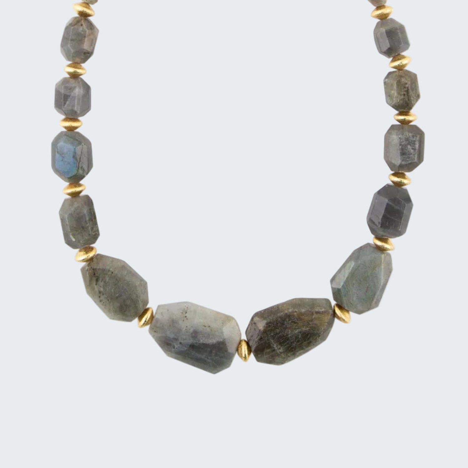 Necklace with gray beads and gold accents on a white background