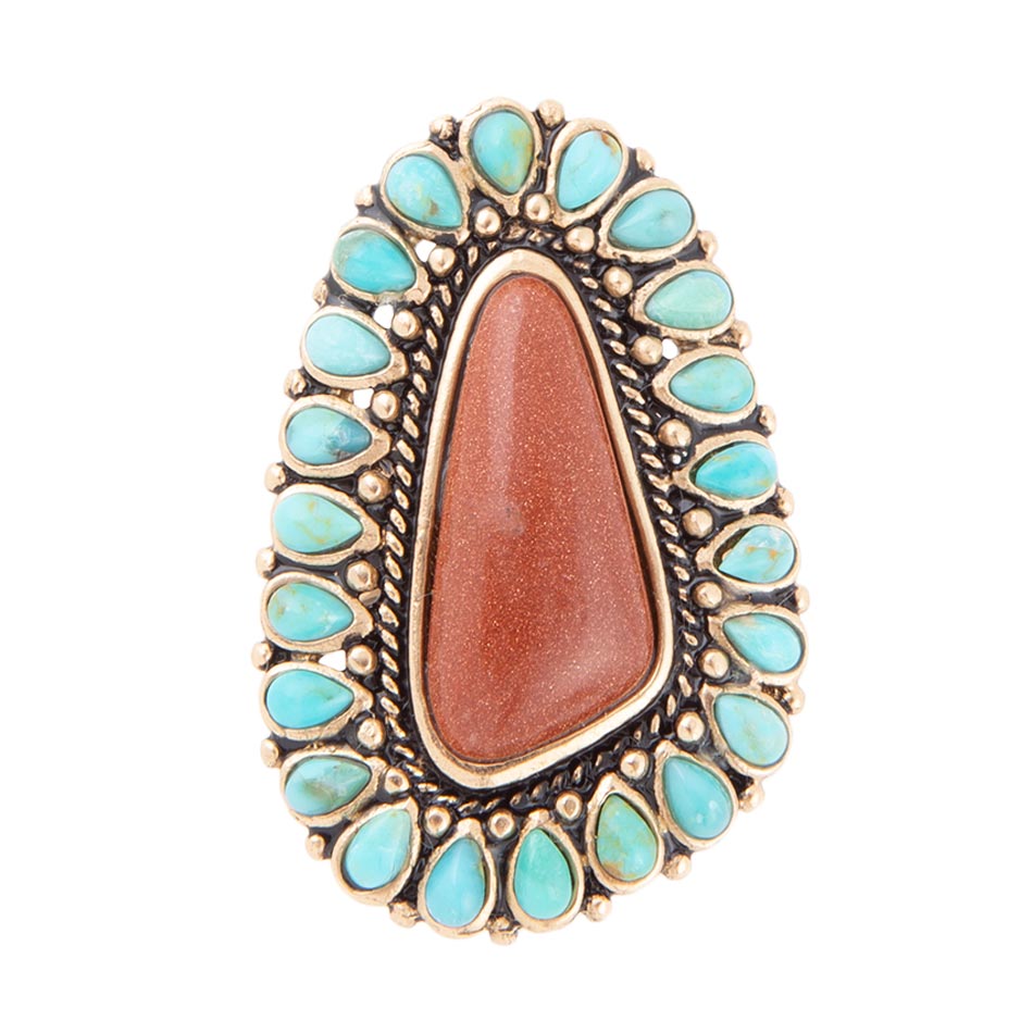 Ring with turquoise stones and a large brown stone on a white background