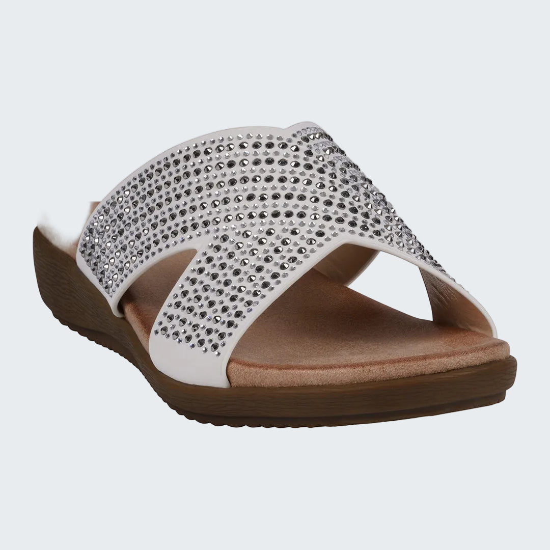 Sandal with rhinestone embellishments on a white background