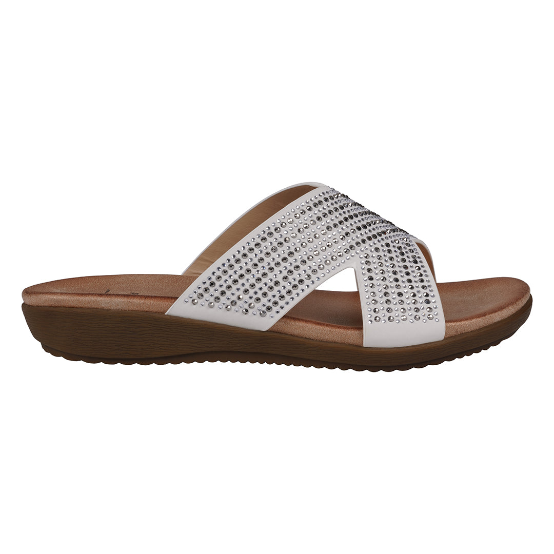 White sandal with brown sole on a white background