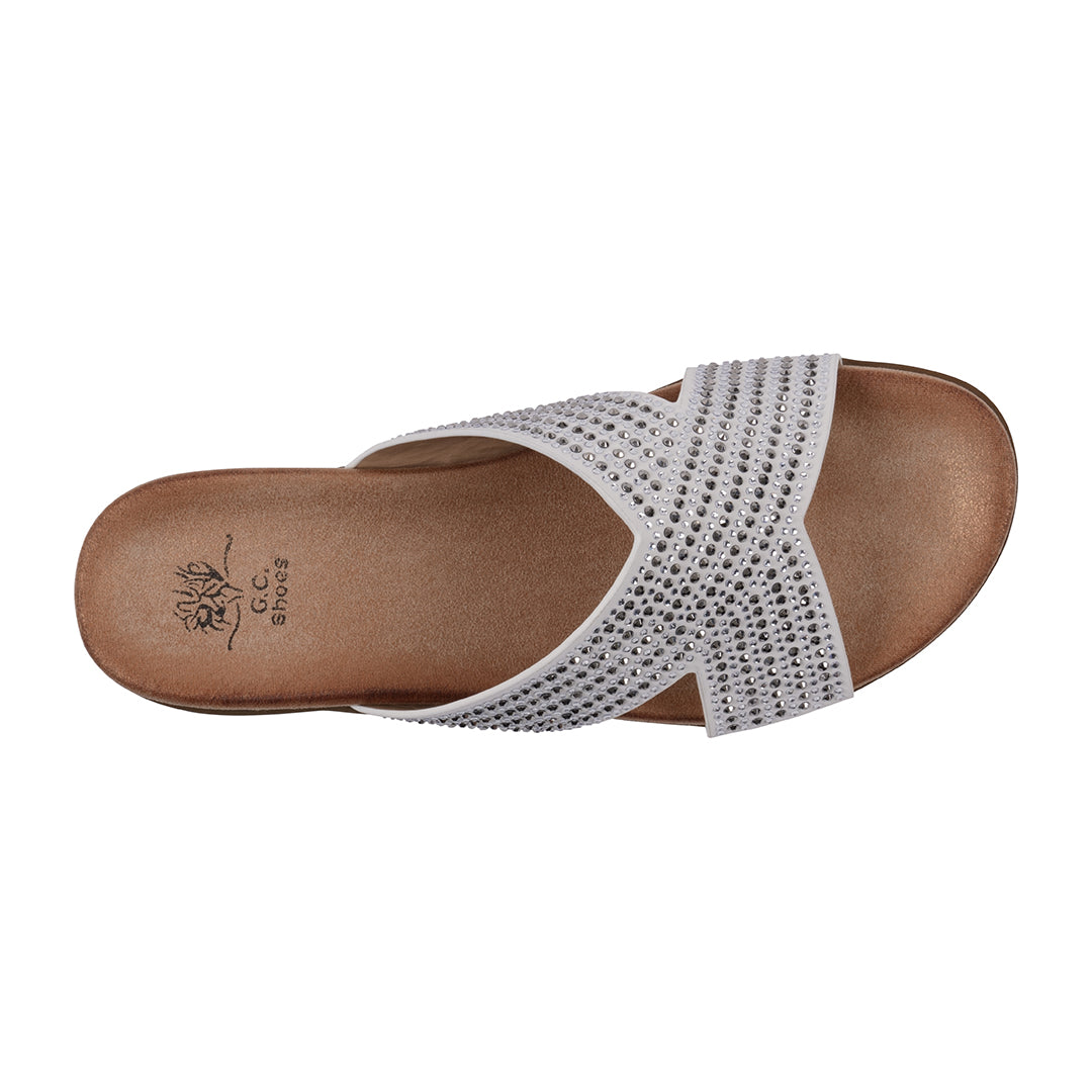 White sandal with brown sole on a white background