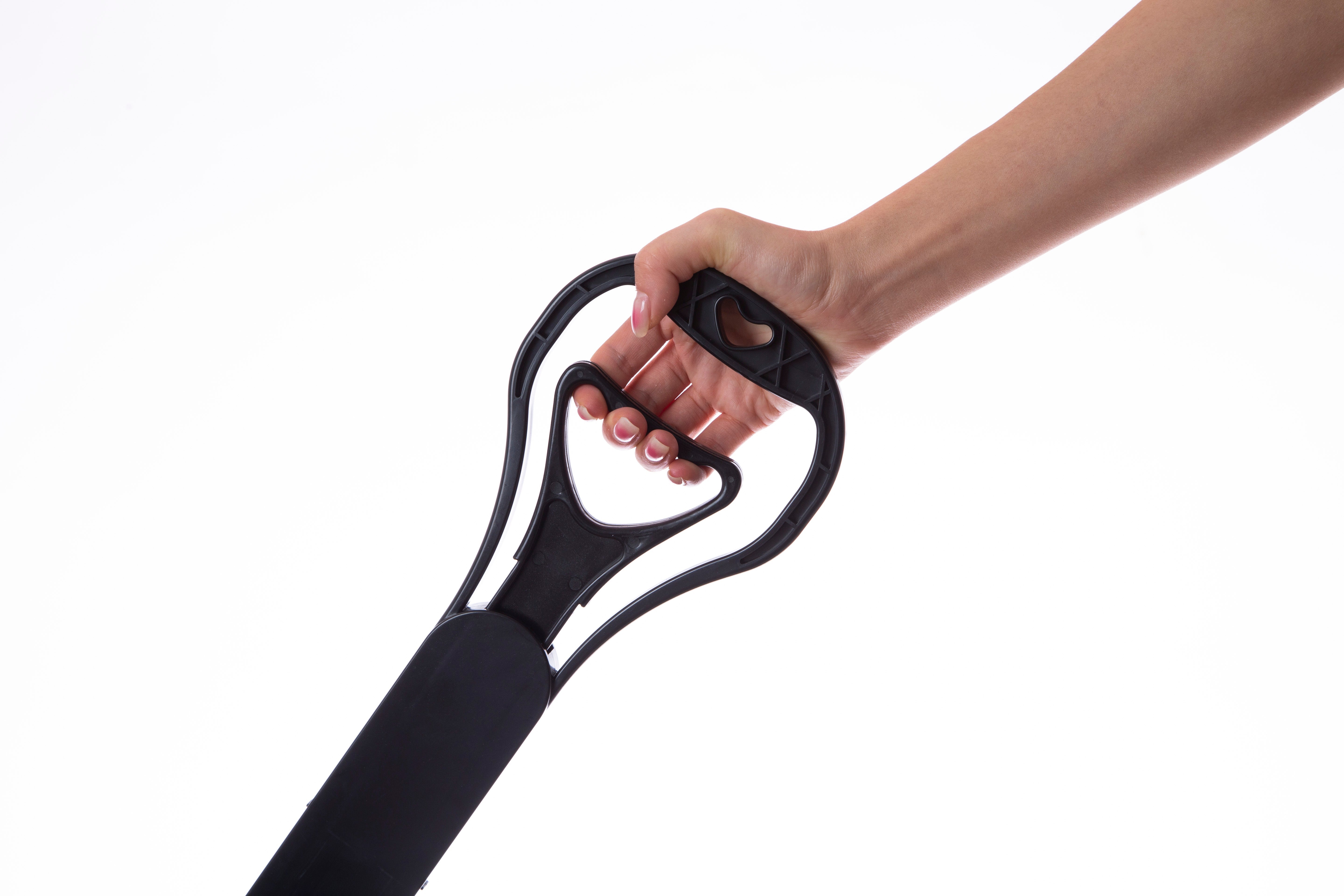 Hand holding a black resistance band against a white background