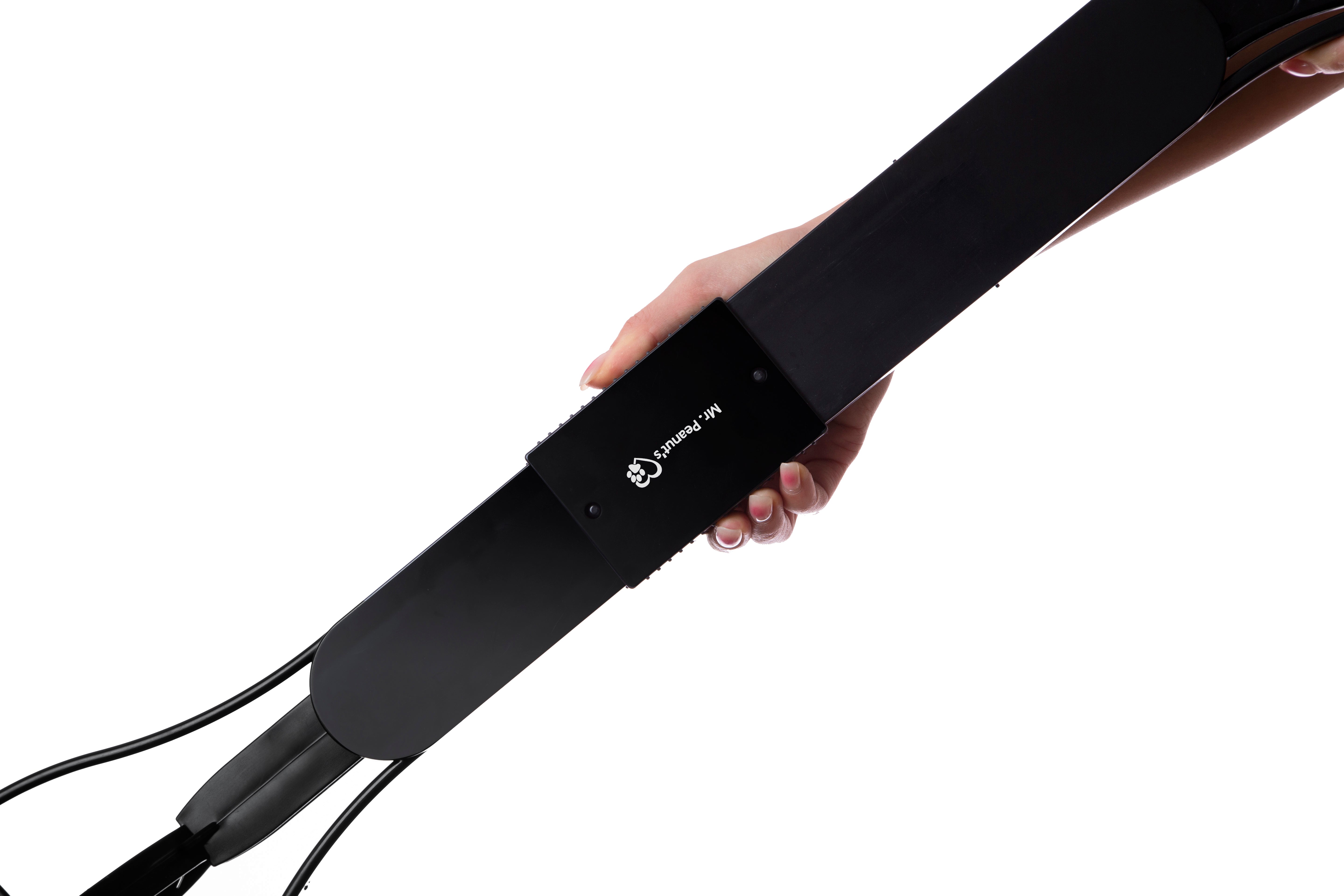 Black electronic device held by a hand on a white background