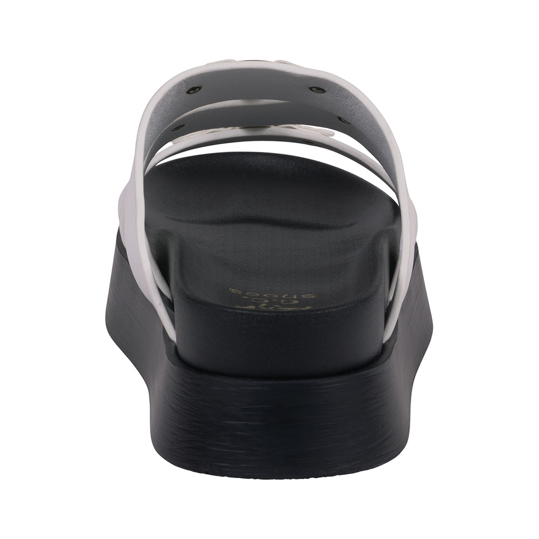 Black sandal with metallic straps on a white background