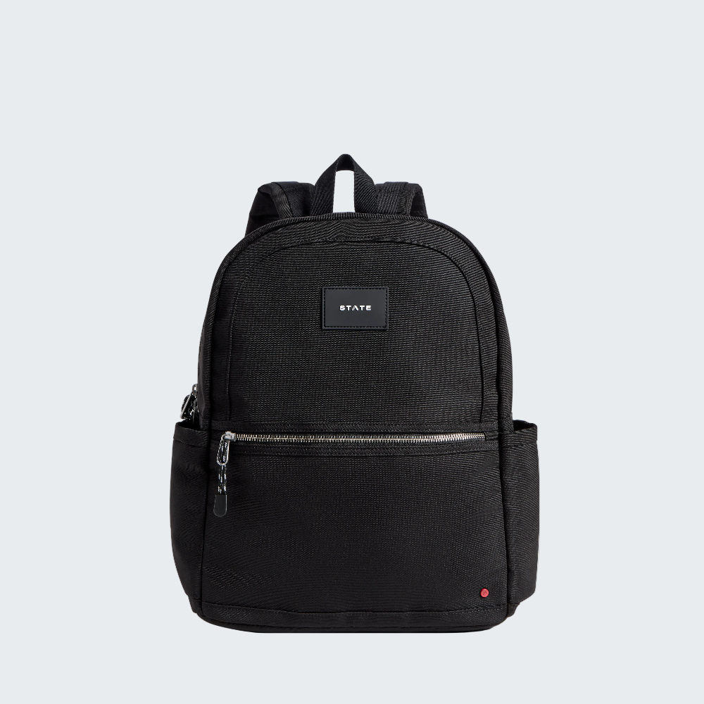 Black backpack with visible brand logo on a white background