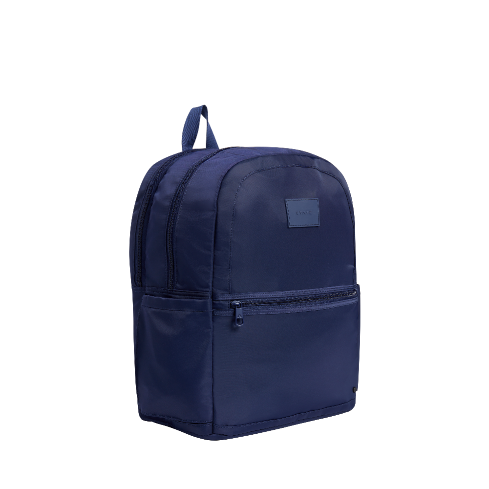 Navy blue backpack with a visible brand logo on a white background