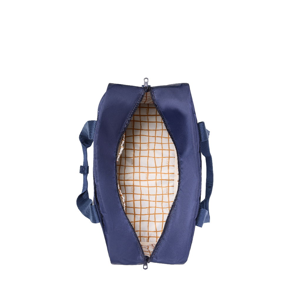 Blue duffel bag with grid pattern interior on a white background