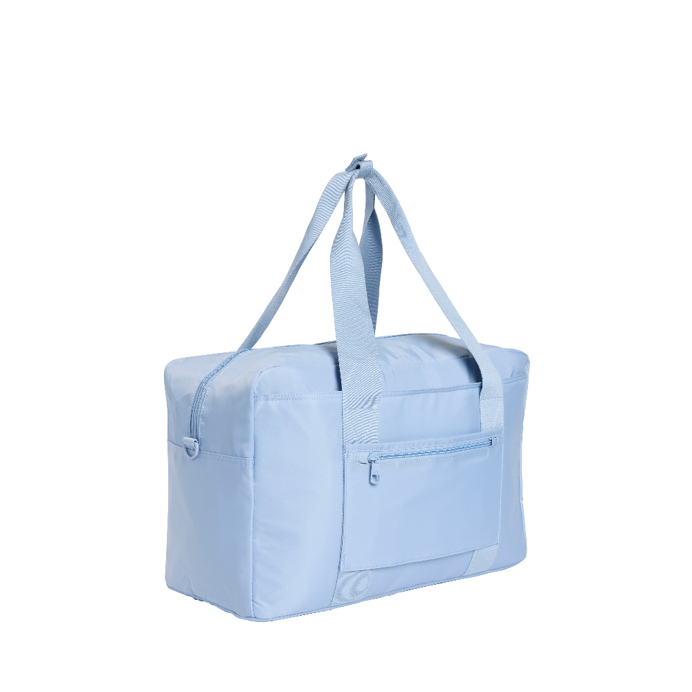 Light blue duffel bag with a handle on a white background
