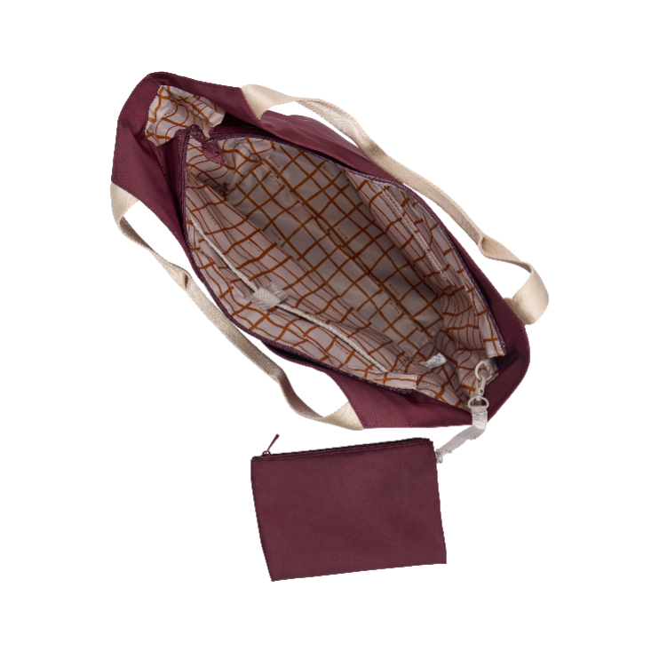 Maroon bag with a grid pattern interior on a white background