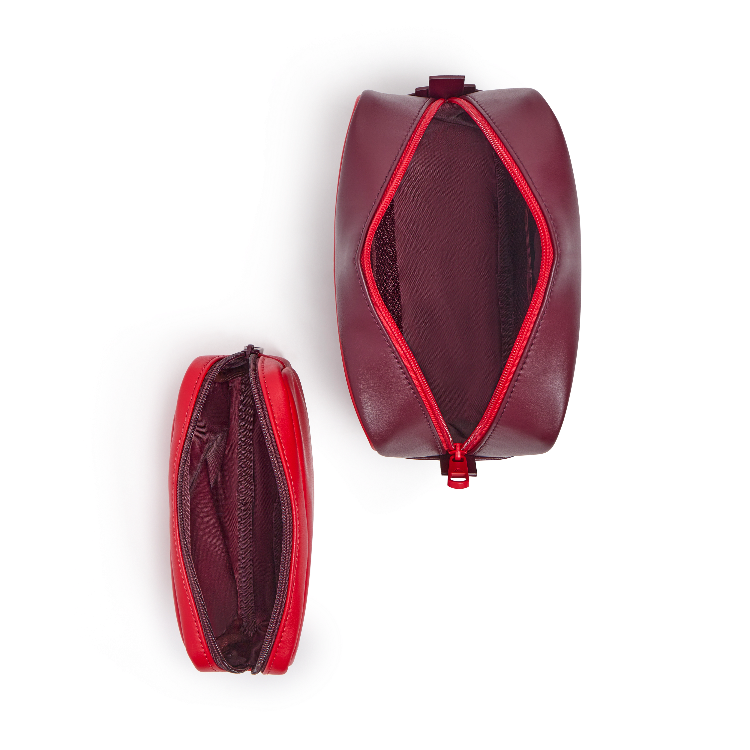 Two burgundy leather zippered cosmetic pouches shown on a white background, one from a top-down view displaying the interior mesh pocket and the other from a side profile view.