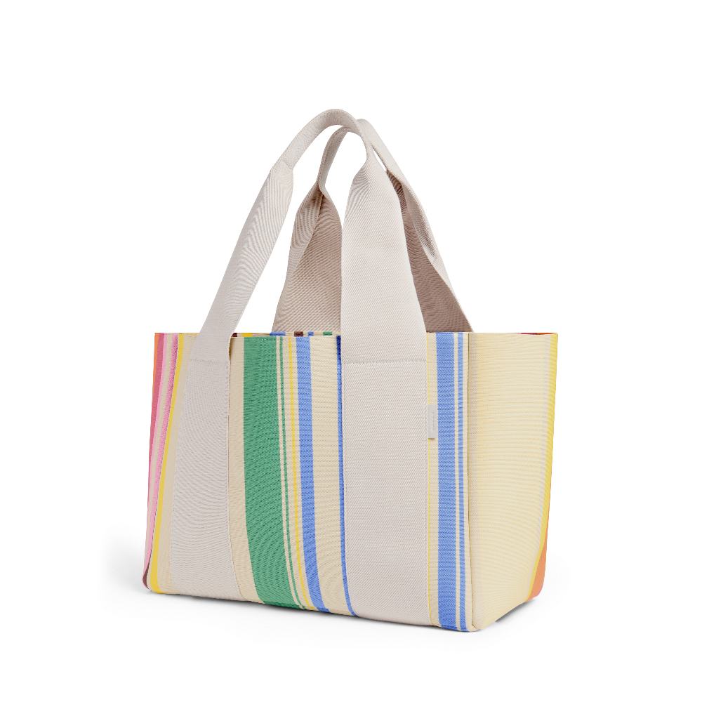 Tote bag with colorful striped pattern on a white background
