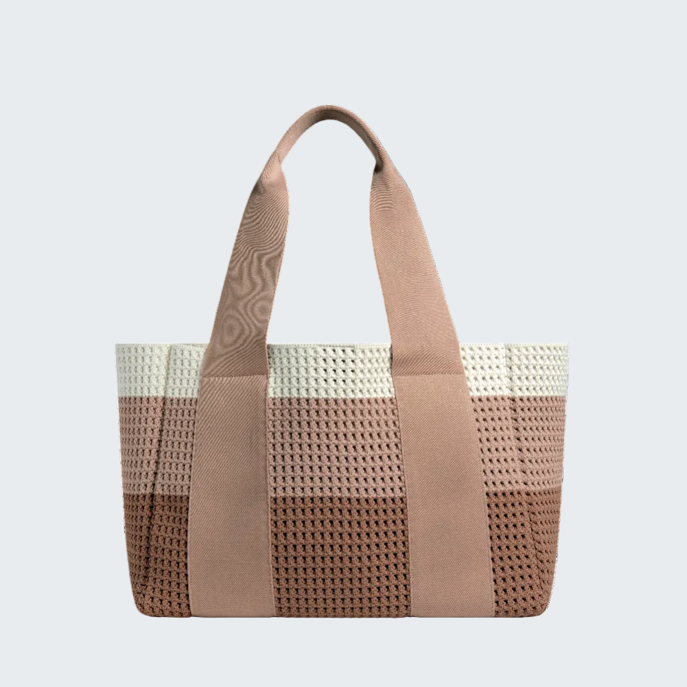 Woven handbag with beige handle and trim on a white background