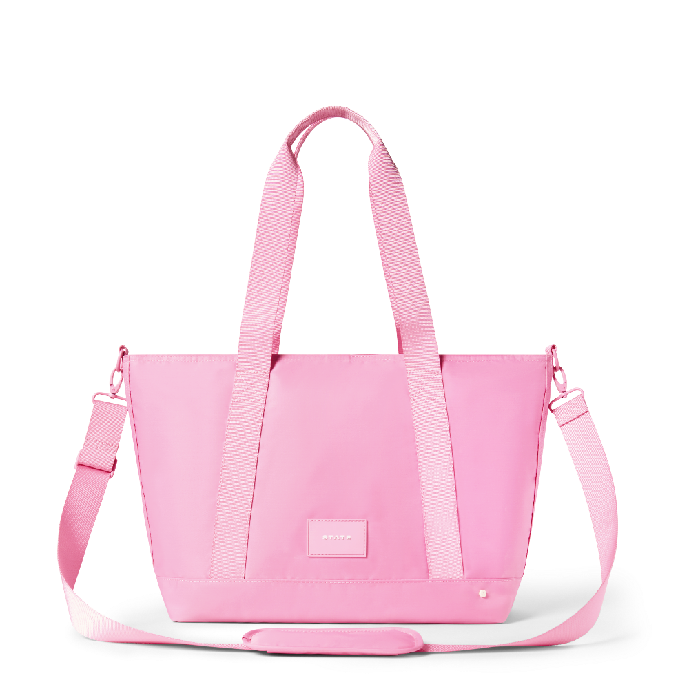 Pink tote bag with shoulder strap on a white background