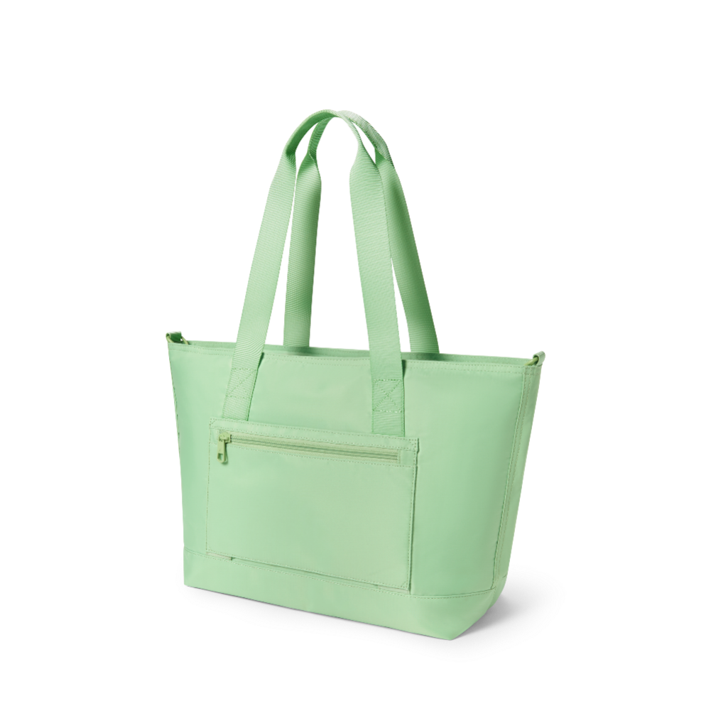 Light green tote bag with a front pocket on a white background