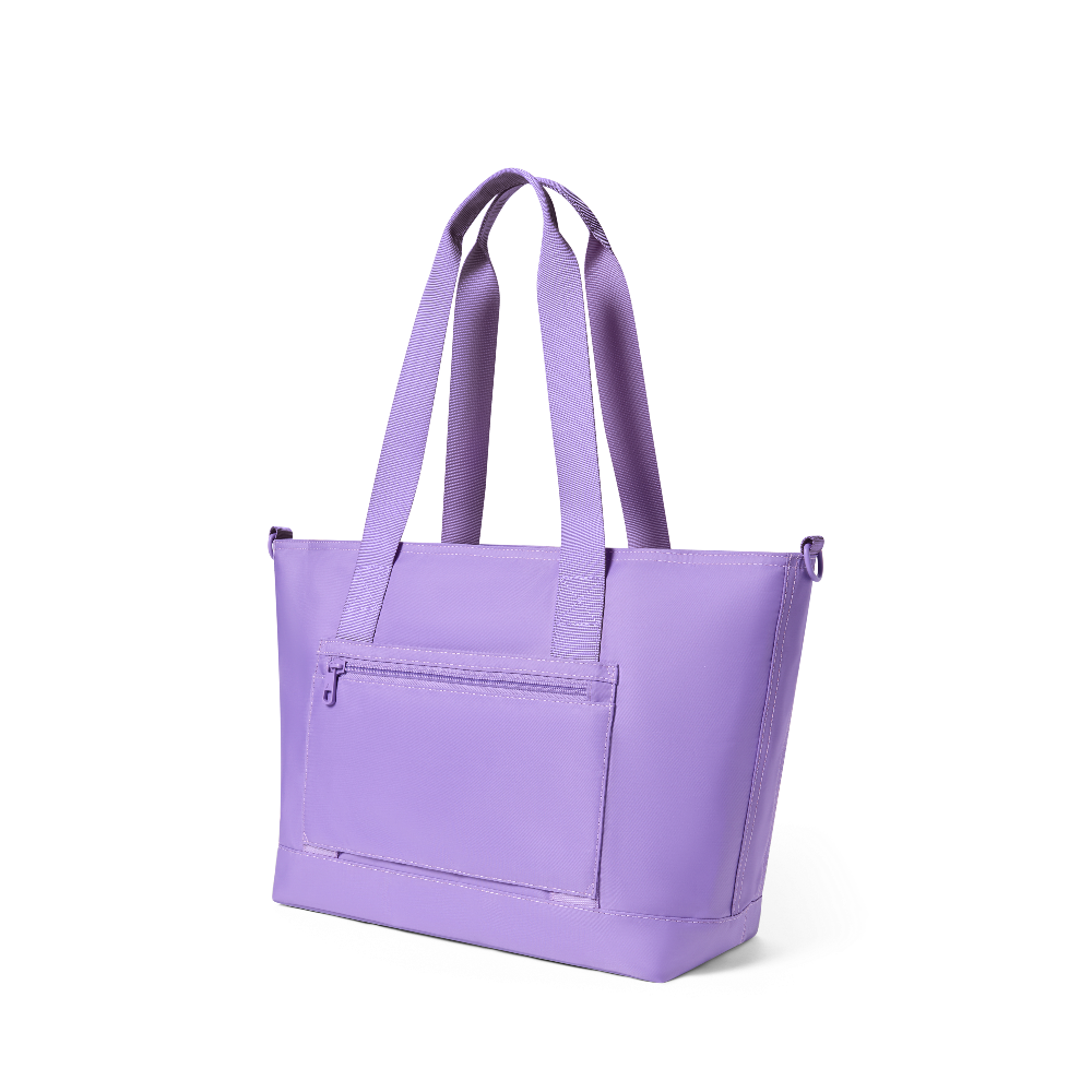 Purple tote bag with a front pocket on a white background
