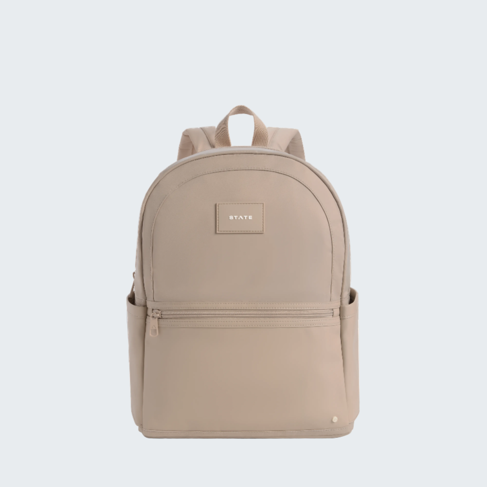 Beige backpack with a visible brand logo on a white background