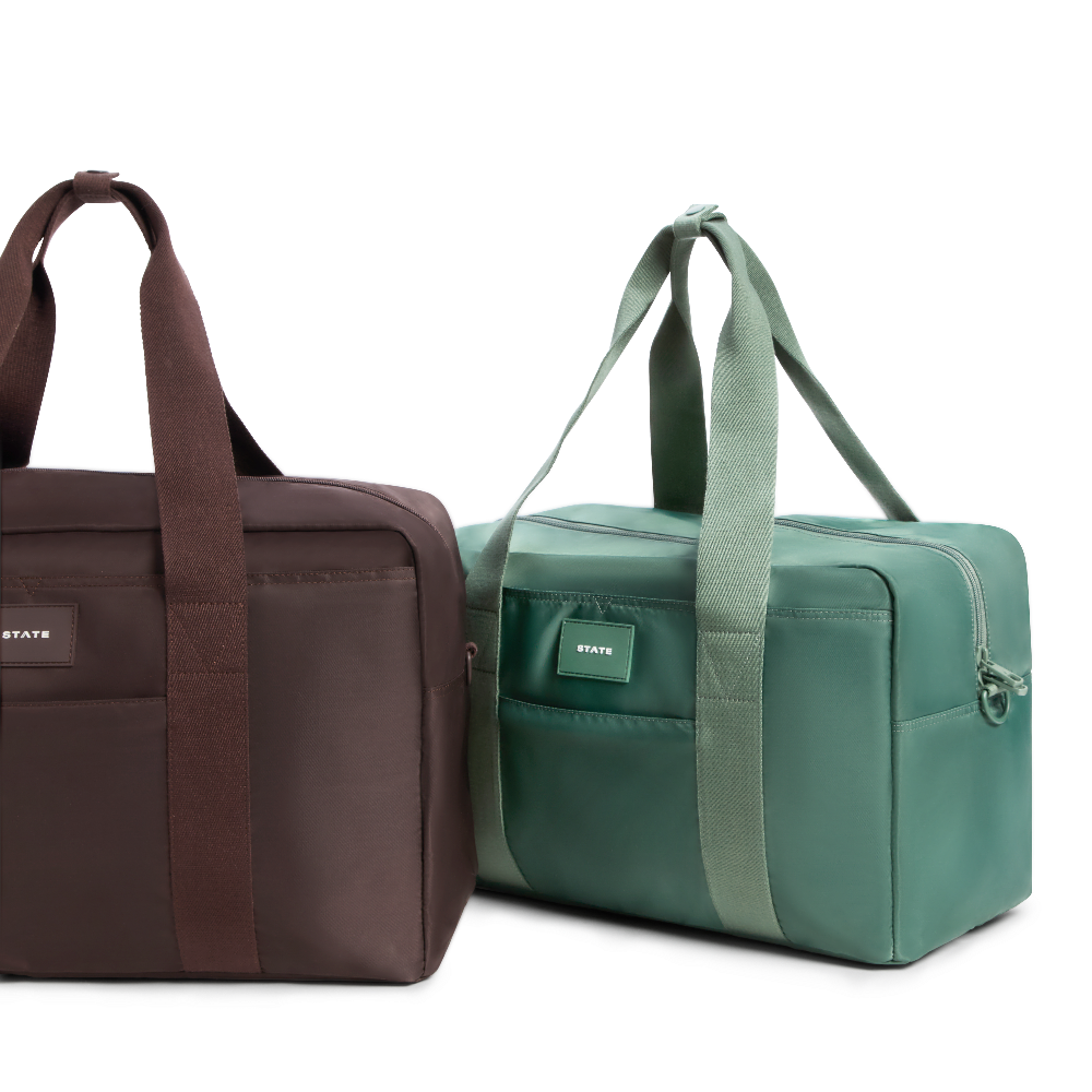 Brown and green duffel bags on a white background