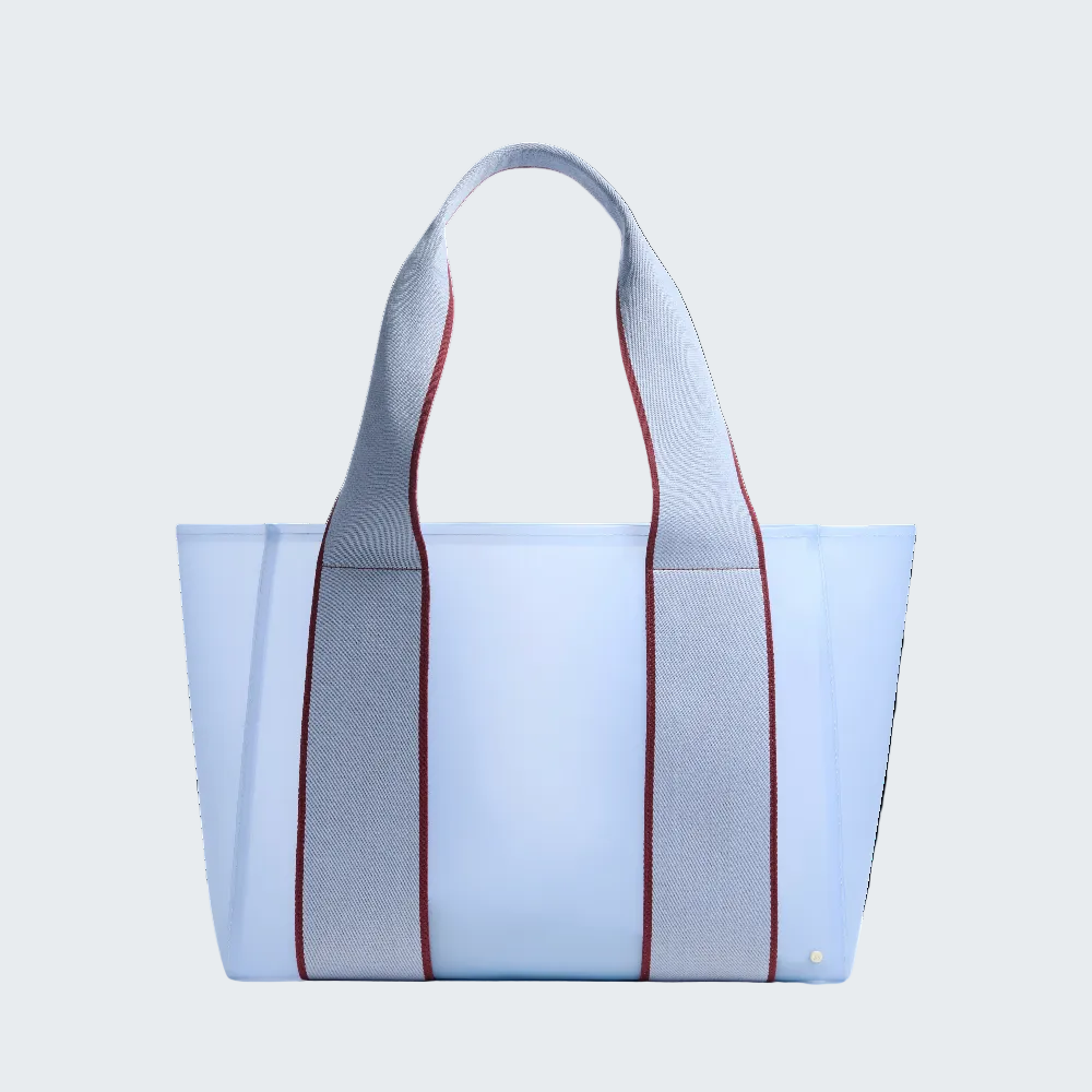 Blue tote bag with red accents on a white background