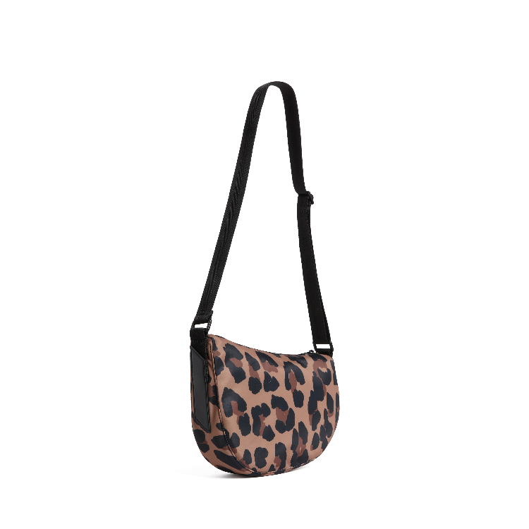 Leopard print crossbody bag on a white background