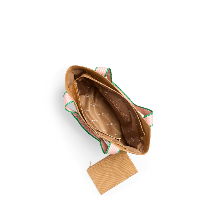 Open handbag with a pink interior on a white background