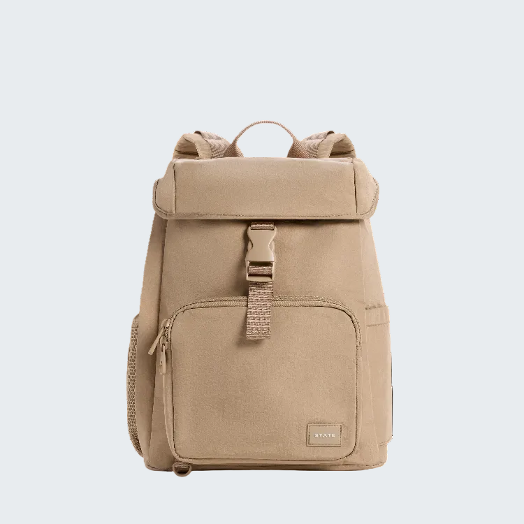 A beige roll-top backpack with a front zippered pocket and a buckle strap closure, photographed against a solid white background.