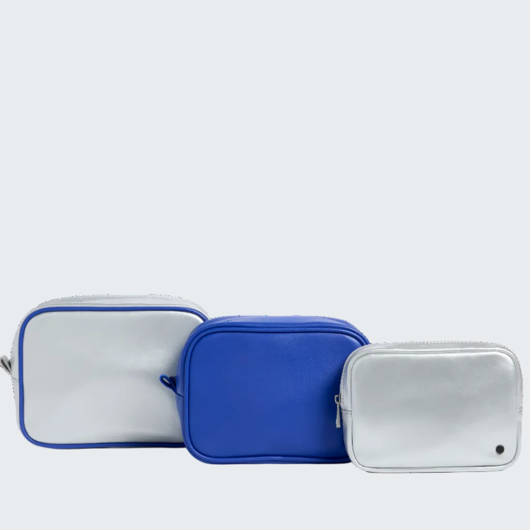 Three rectangular zippered pouches in silver and blue, arranged by size on a clean white background.
