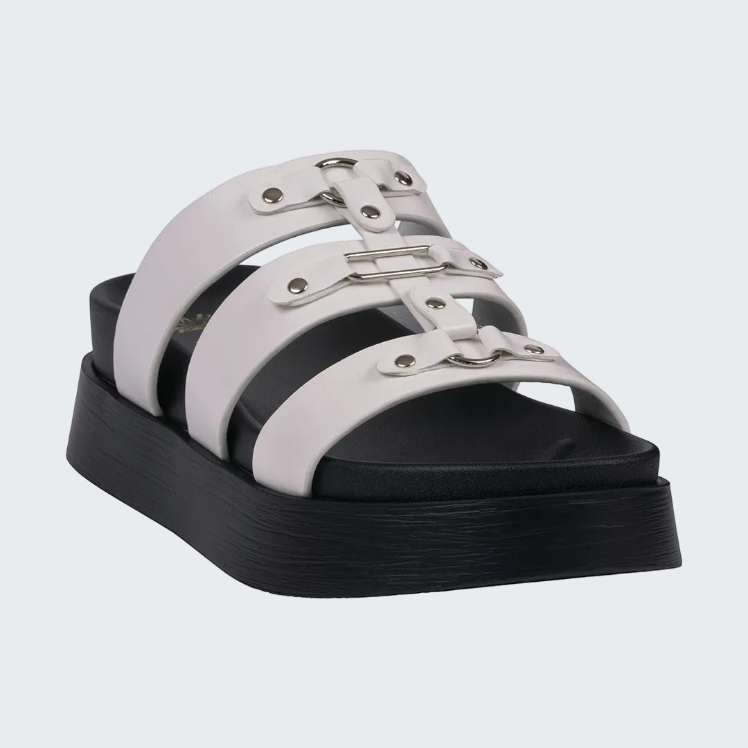 White sandal with black platform sole on a white background