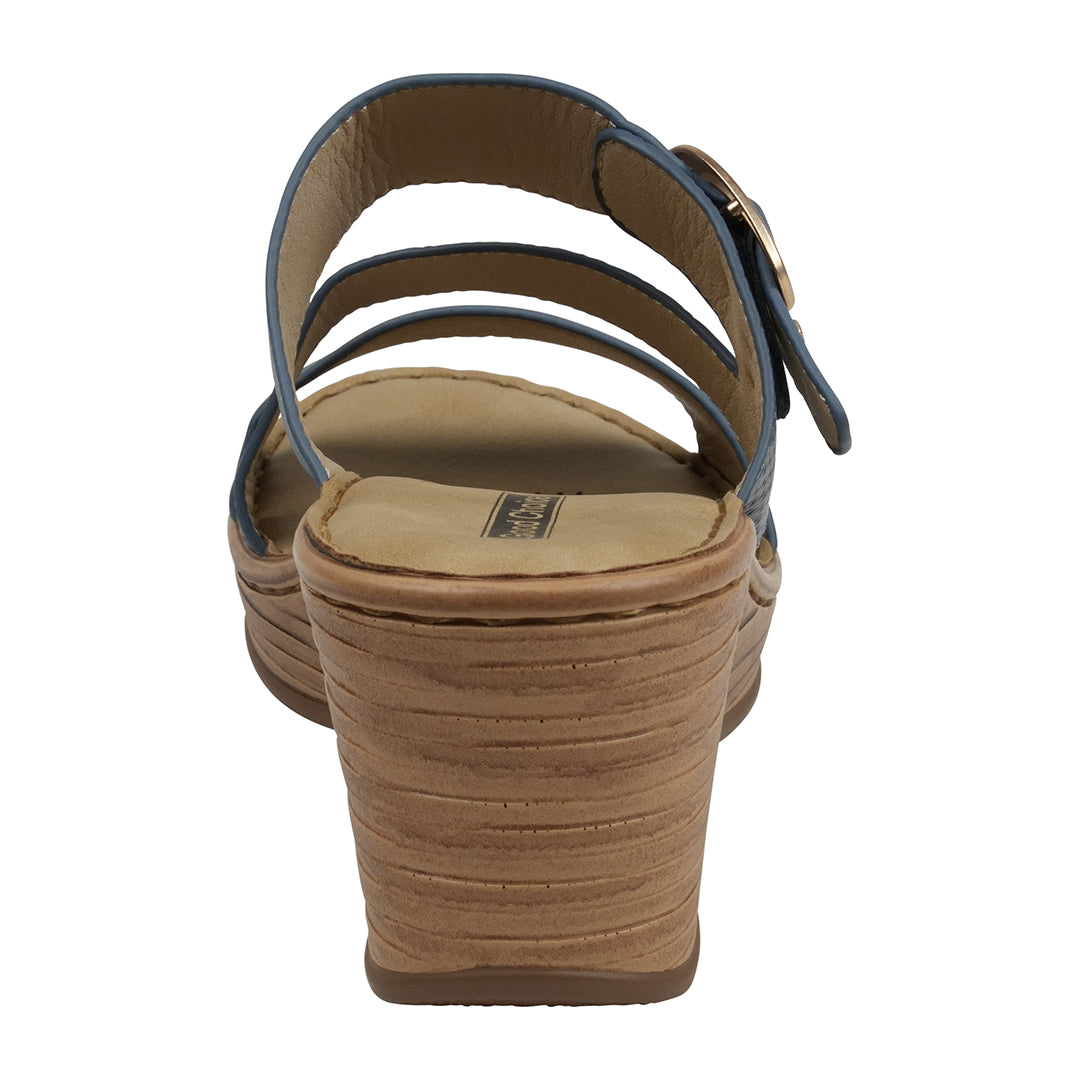 Brown sandal with multiple straps on a white background