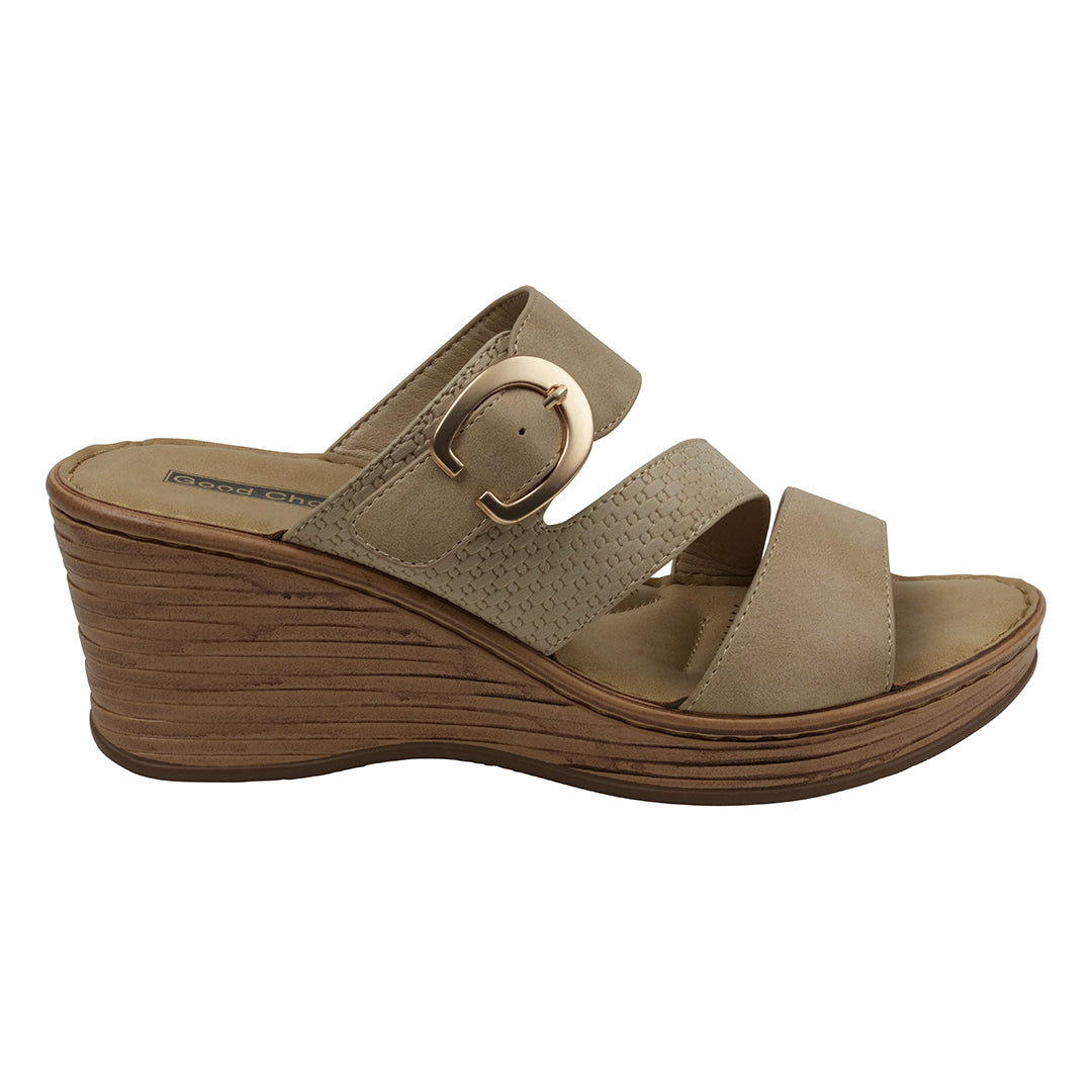 Beige wedge sandal with a strap and buckle on a white background