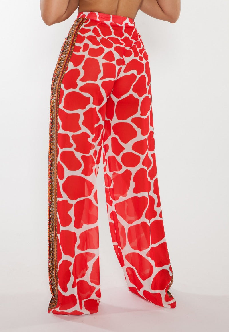 Red patterned pants with a white background