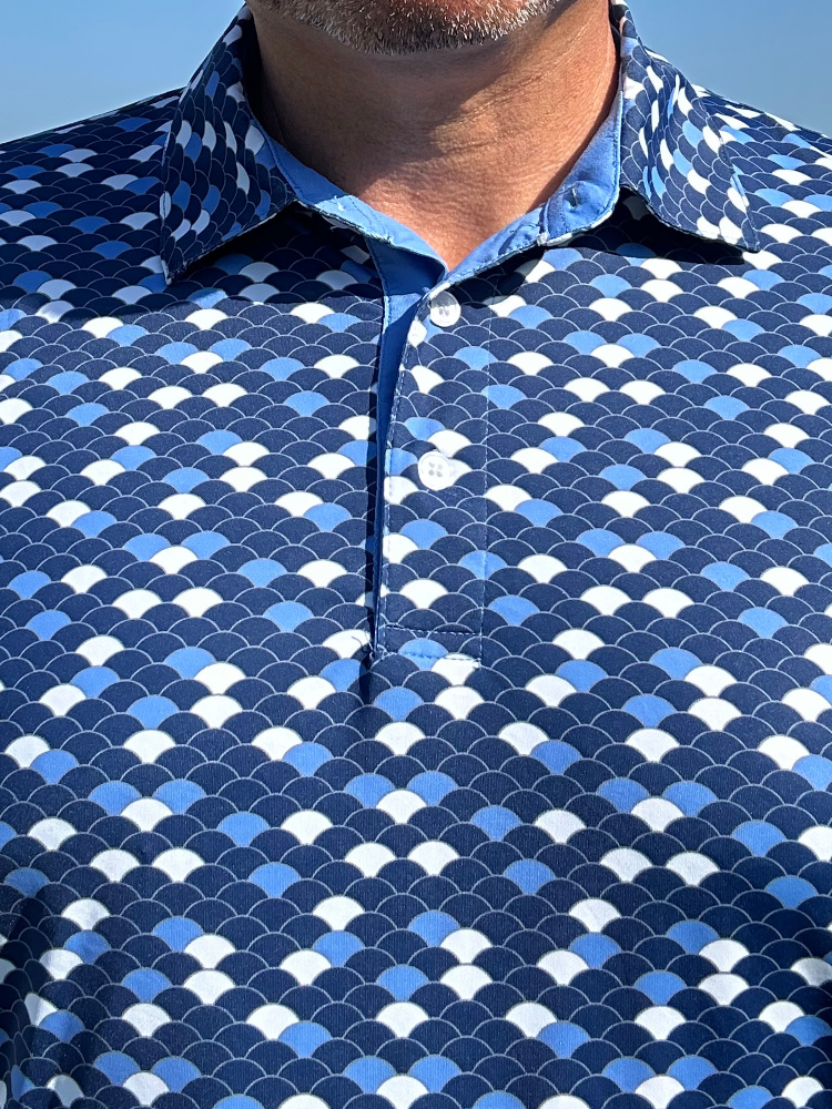 Close-up of a blue and white patterned shirt with a clear sky background