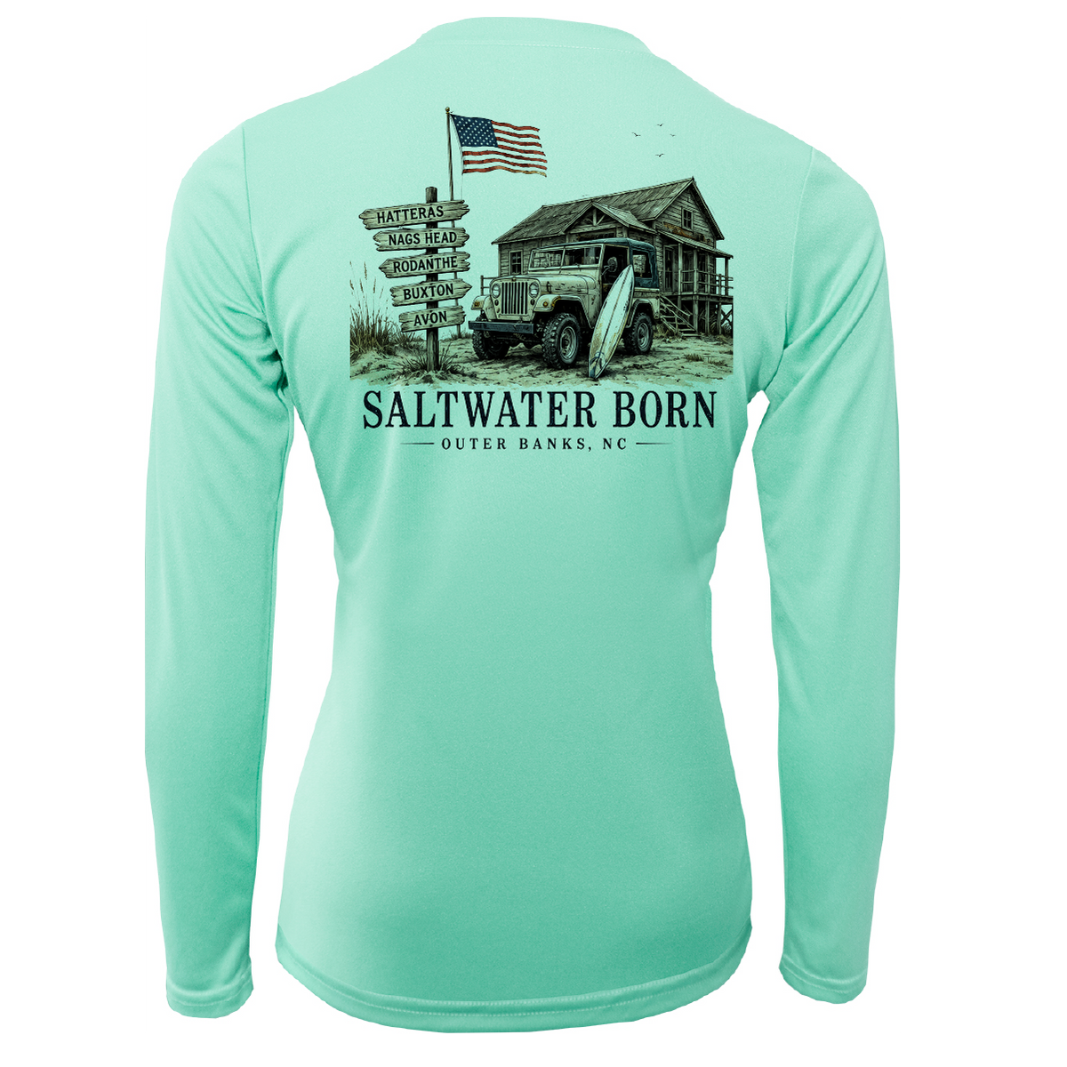 A mint green long-sleeve performance shirt shown from the back, featuring a large graphic print of a vintage truck, a cabin, a signpost, an American flag, and the text 'SALTWATER BORN OUTER BANKS, NC'.