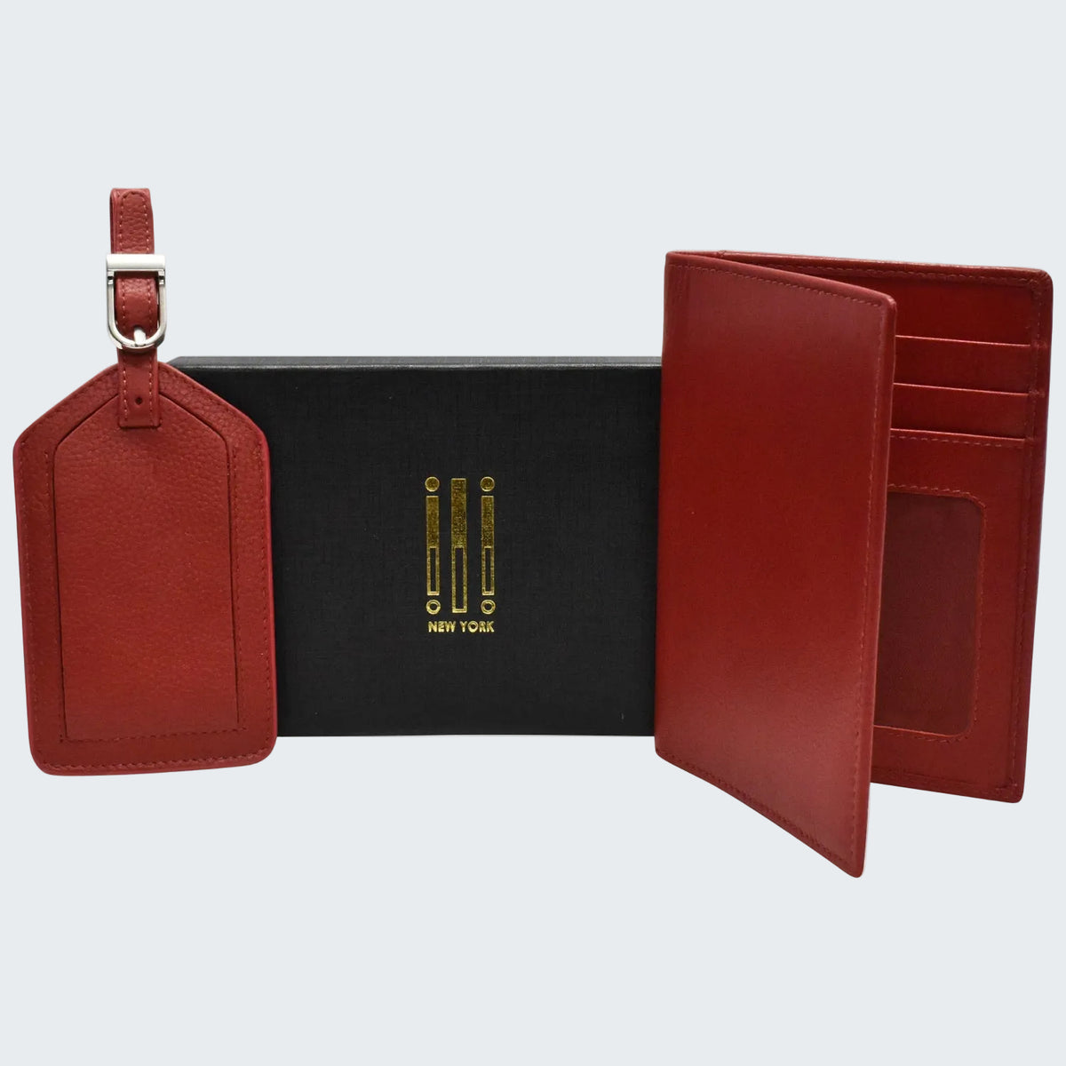 Red leather wallet and luggage tag with a black box on a white background