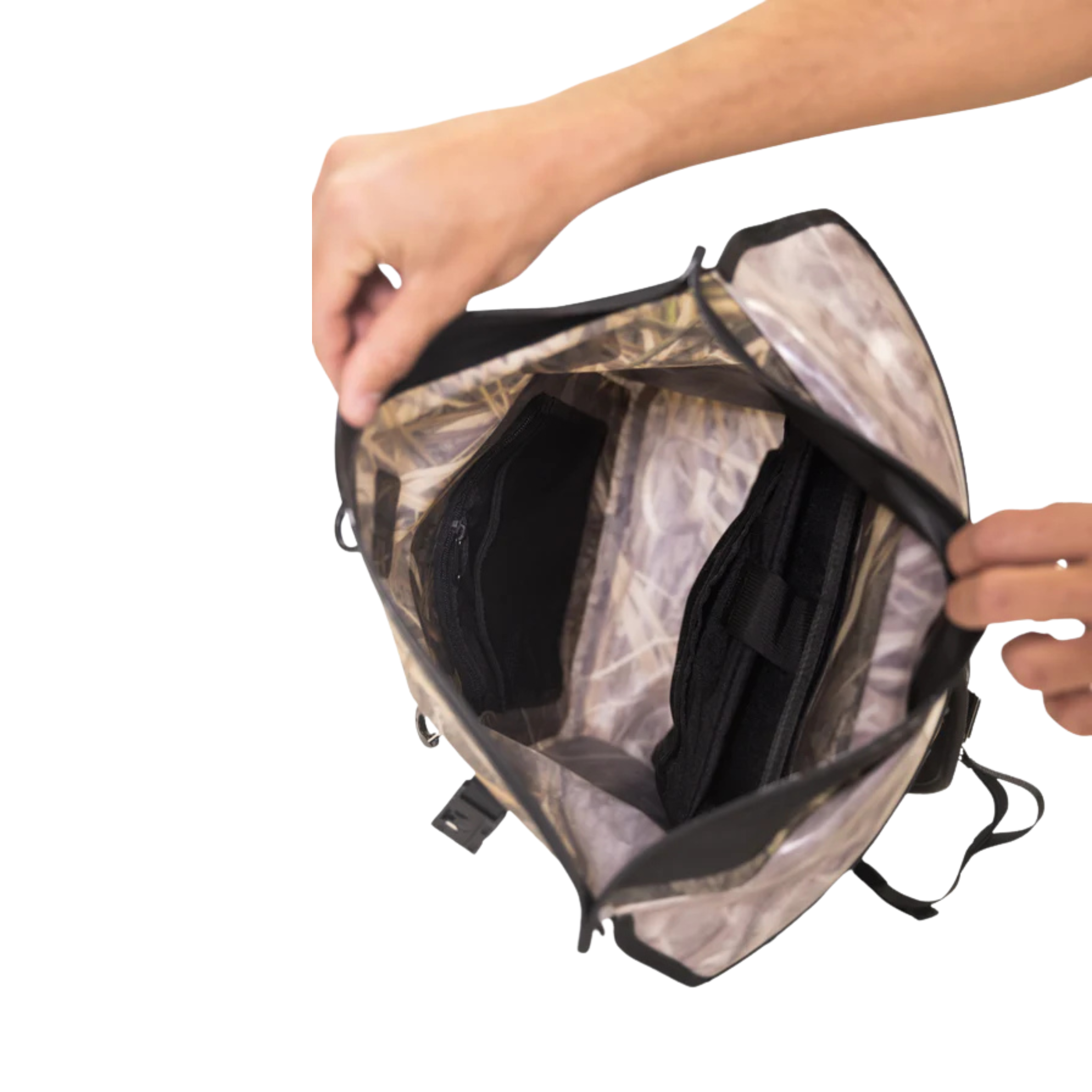 Person opening a camouflage backpack with a white background