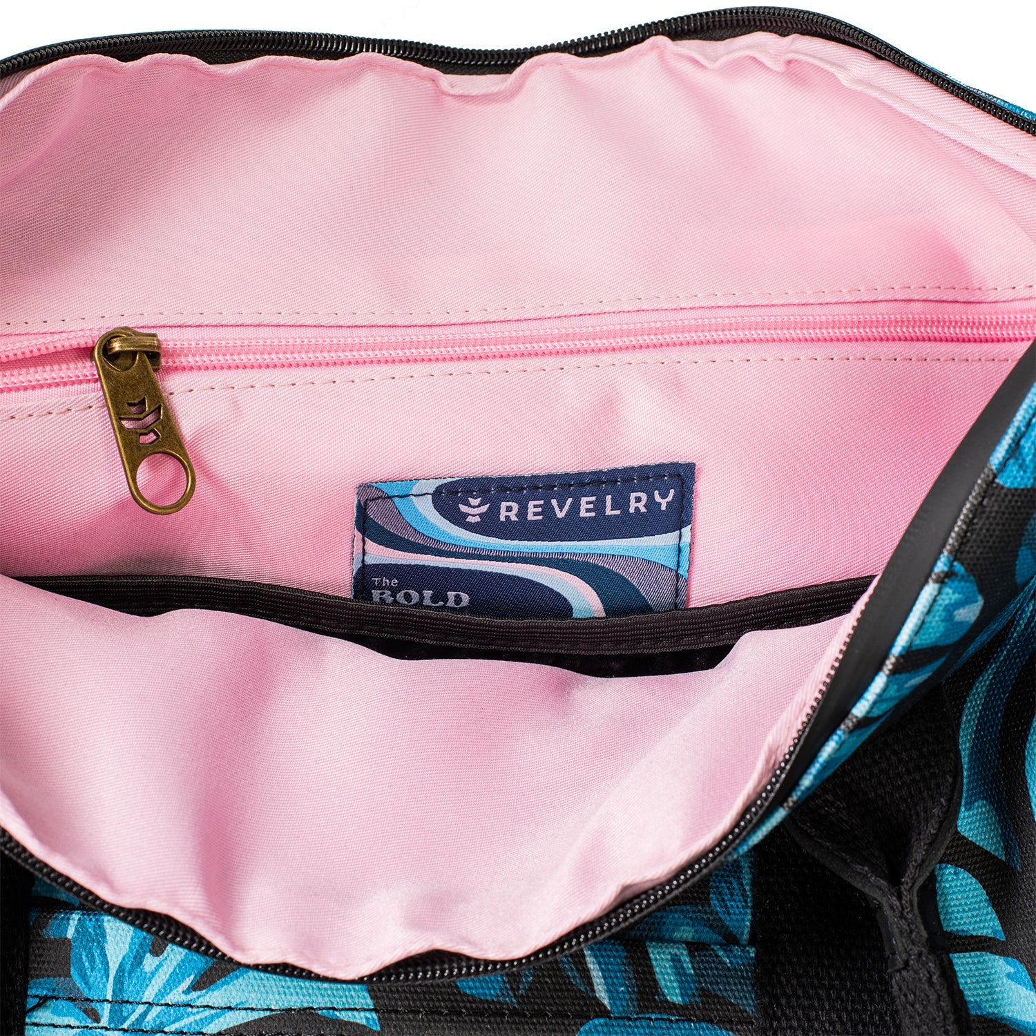 Pink interior of a bag with a Revelry label inside