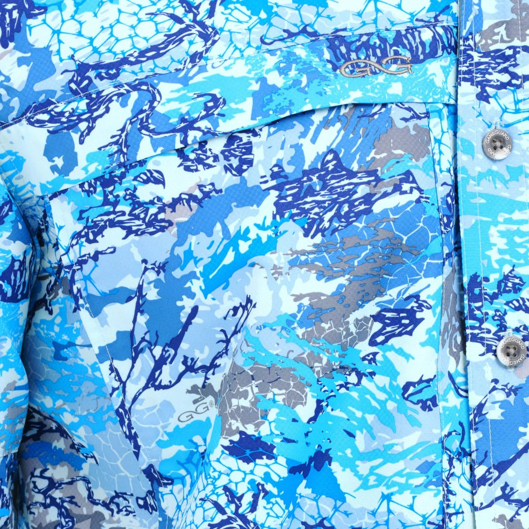 Close-up of a blue and gray camouflage pattern on a fabric surface.