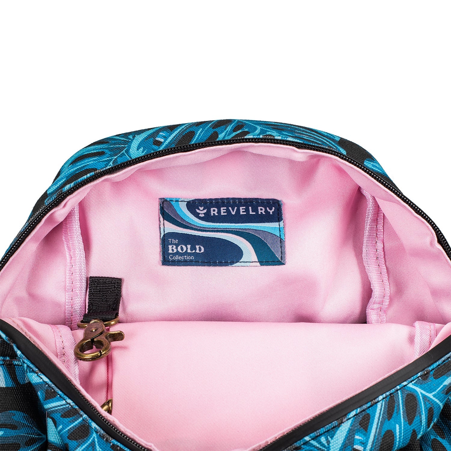Open bag with pink interior and blue floral pattern, featuring a Revelry label.
