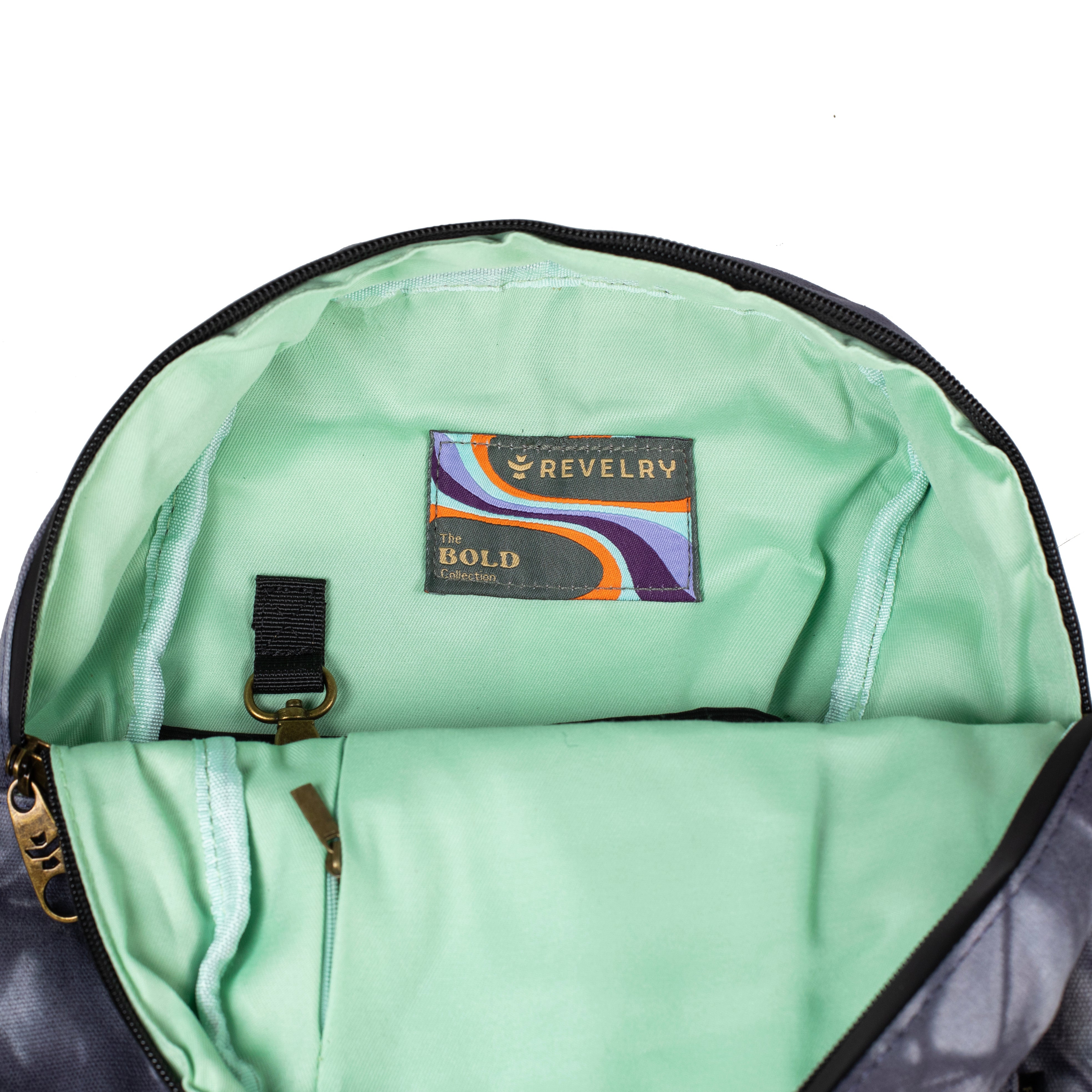 Green backpack interior with a visible brand label on a white background