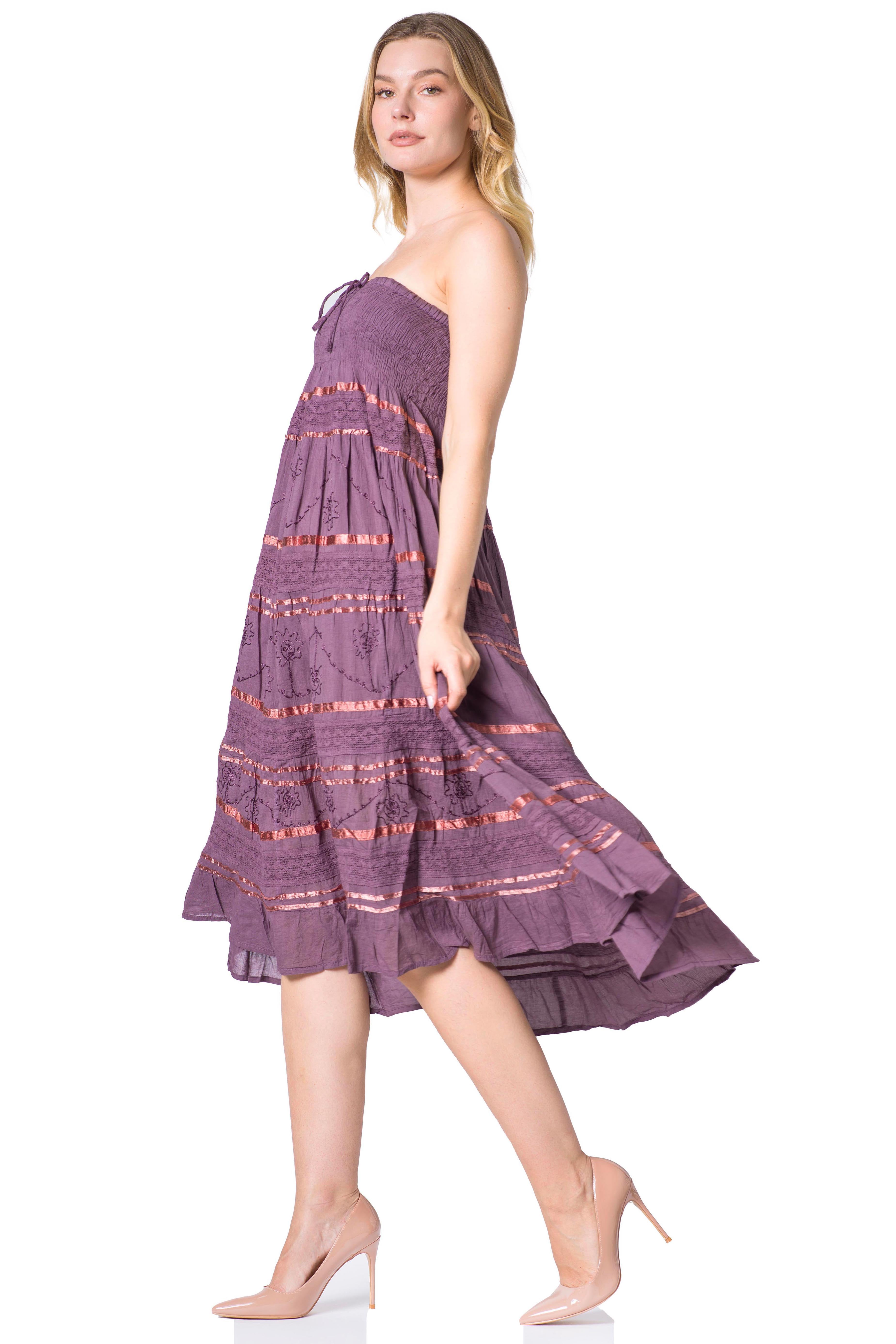 Woman wearing a purple dress with a white background