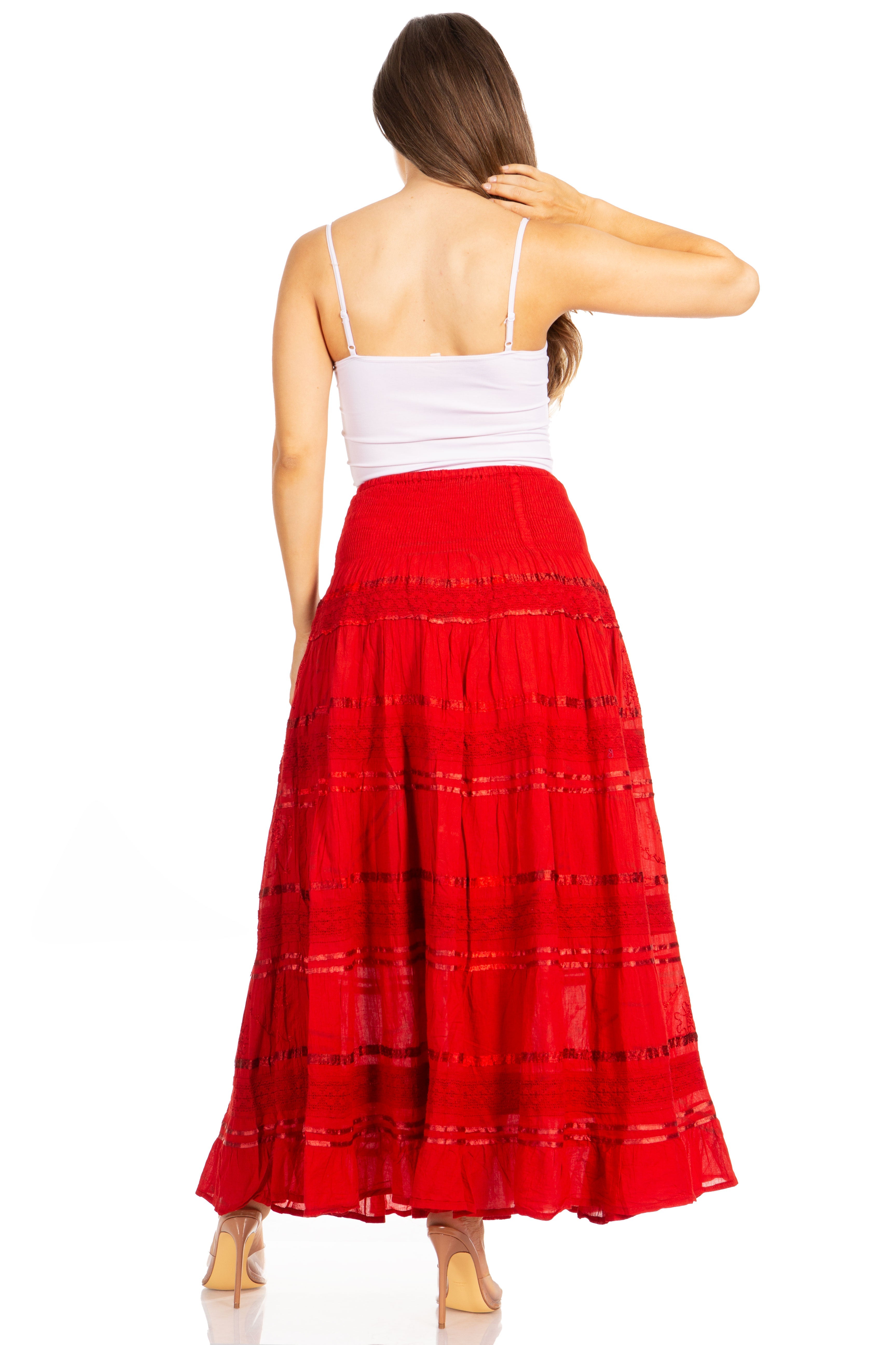 Woman wearing a red skirt and white top on a white background