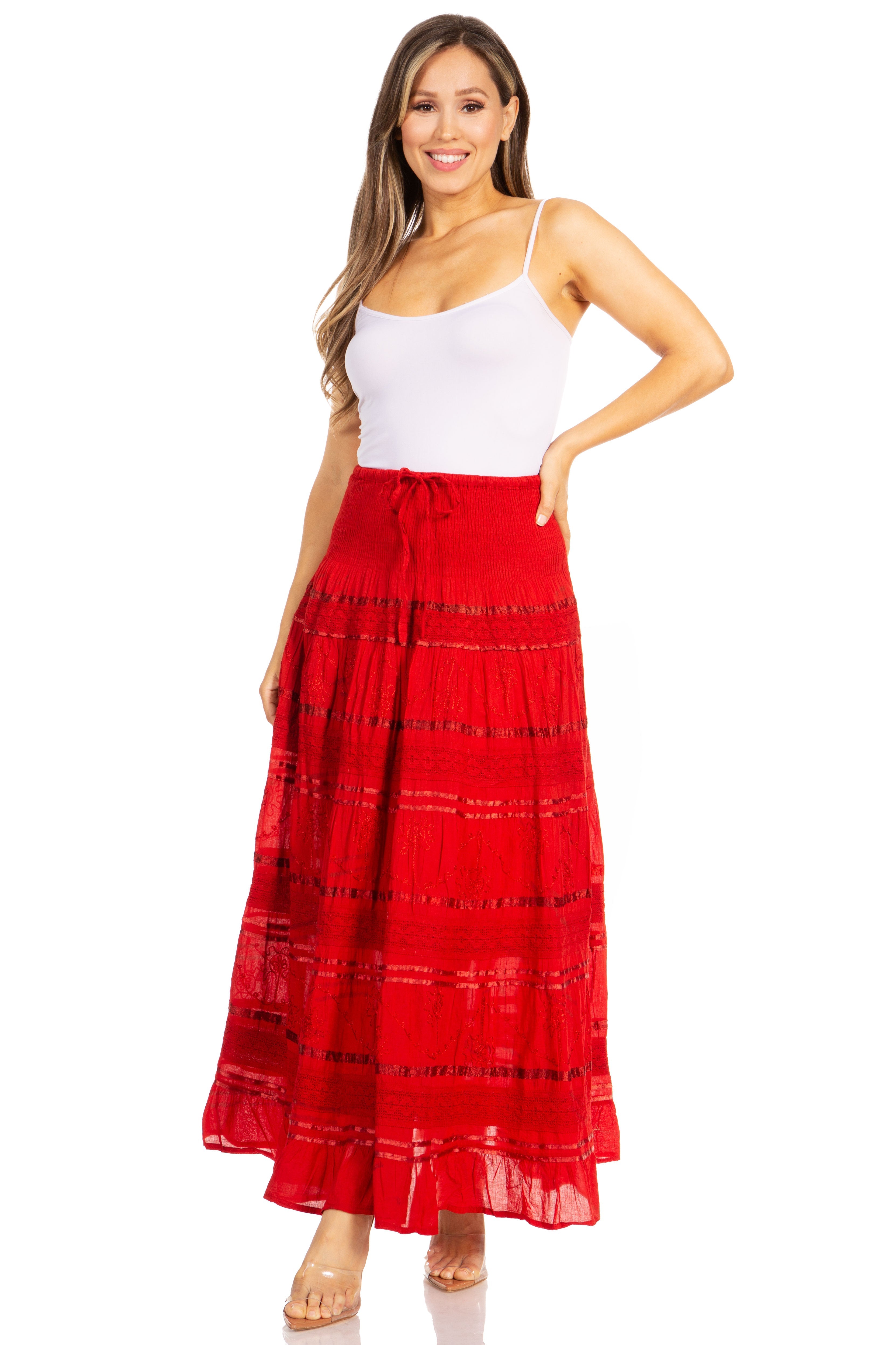 Woman wearing a white top and red skirt on a white background